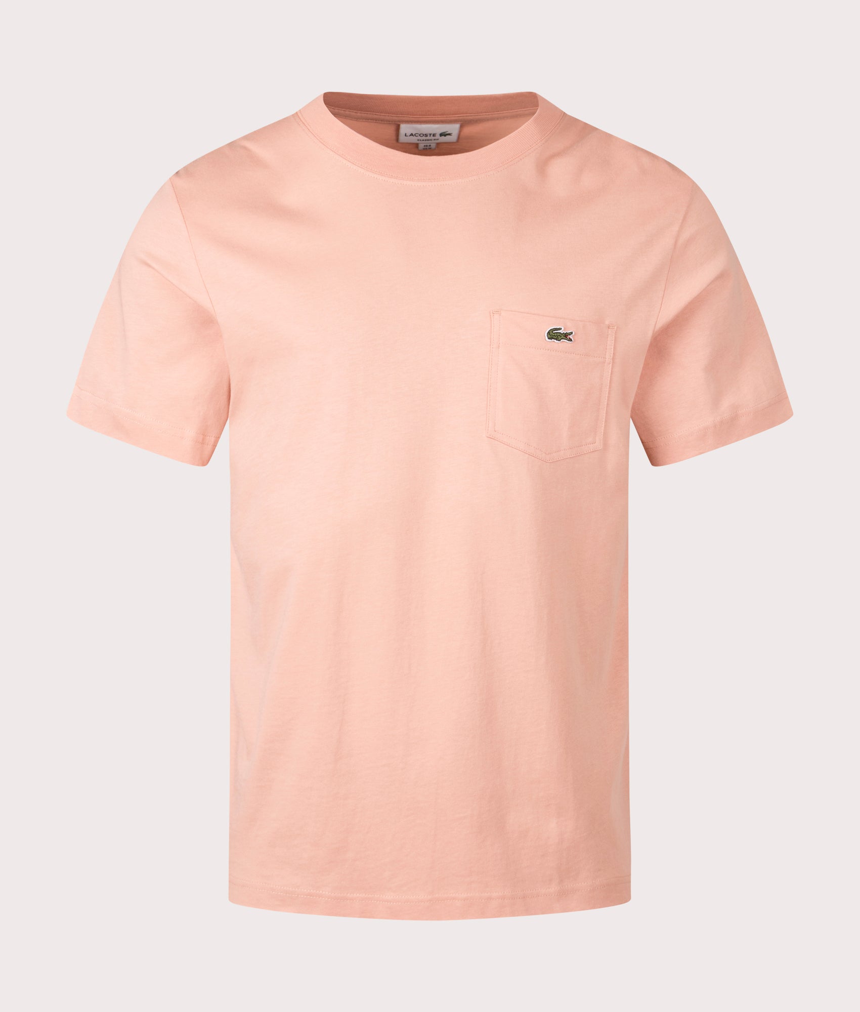 Lacoste Chest Pocket Cotton T-Shirt in Latte. Shot at EQVVS. Front Shot