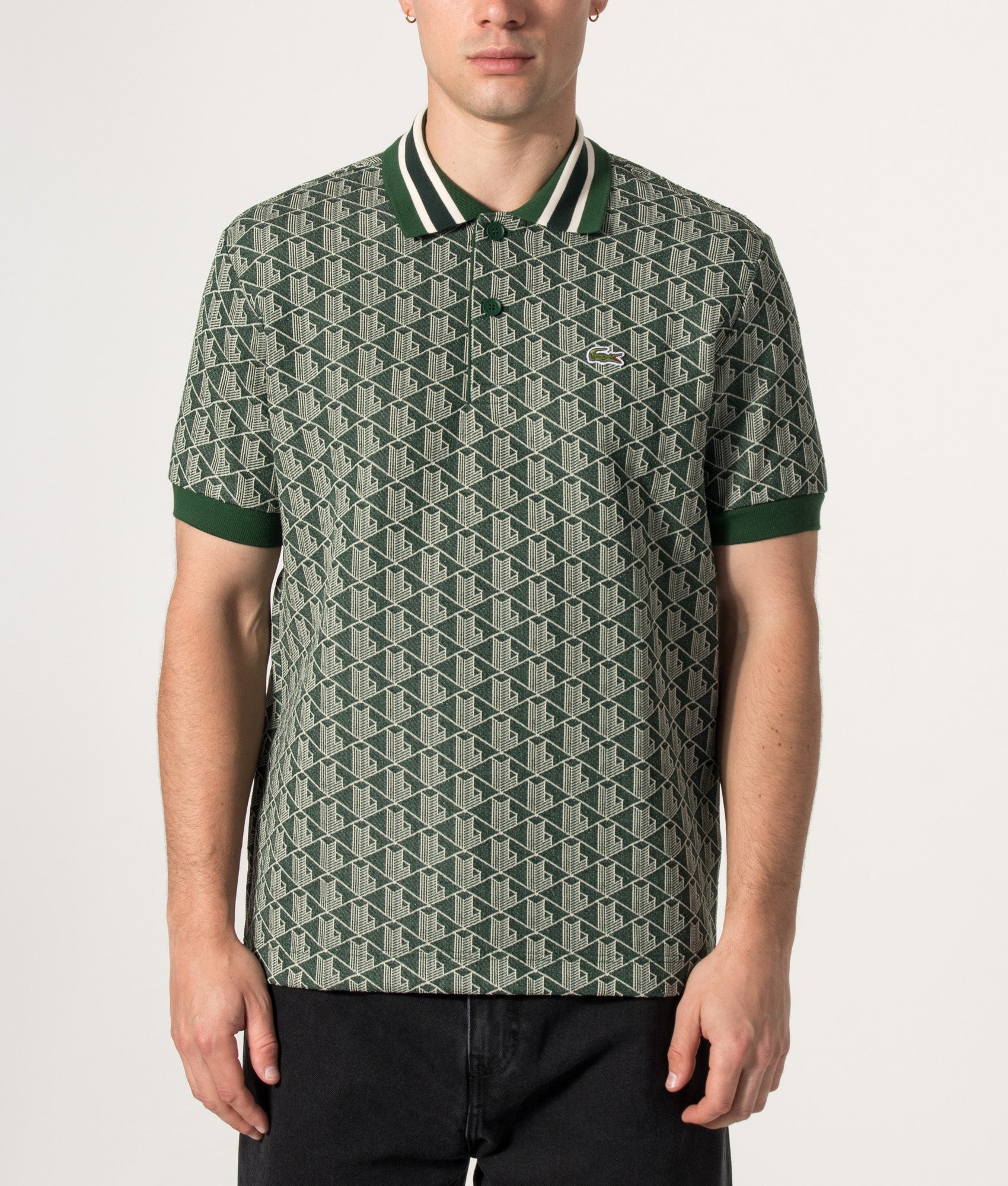 Lacoste Regular Fit Monogram Jacquard Polo Shirt in Green at EQVVS Menswear. Model front shot.