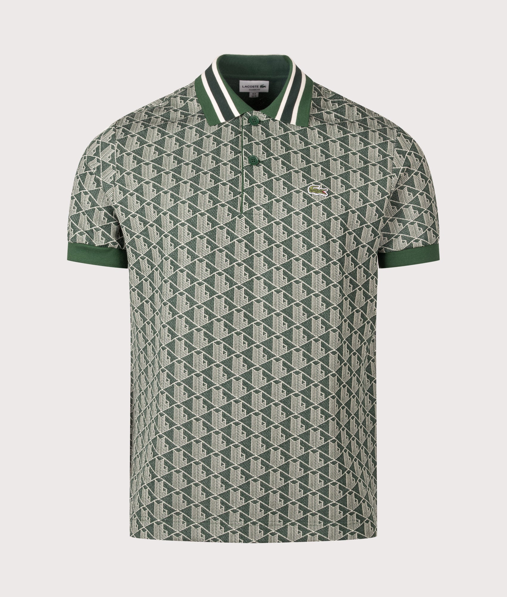 Lacoste Regular Fit Monogram Jacquard Polo Shirt in Green at EQVVS Menswear. Front shot.