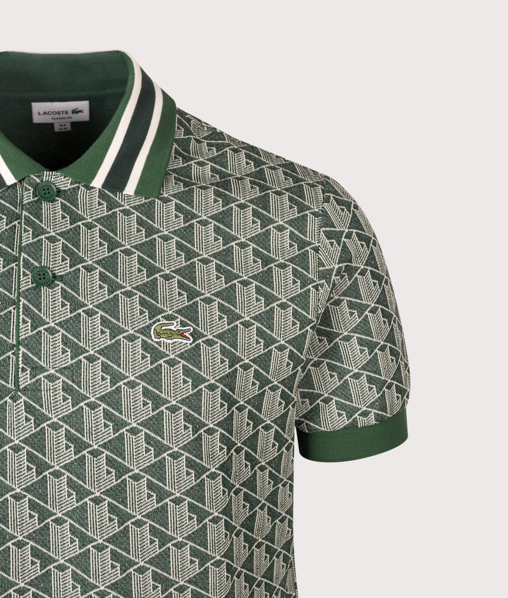 Lacoste Regular Fit Monogram Jacquard Polo Shirt in Green at EQVVS Menswear. Detail shot.