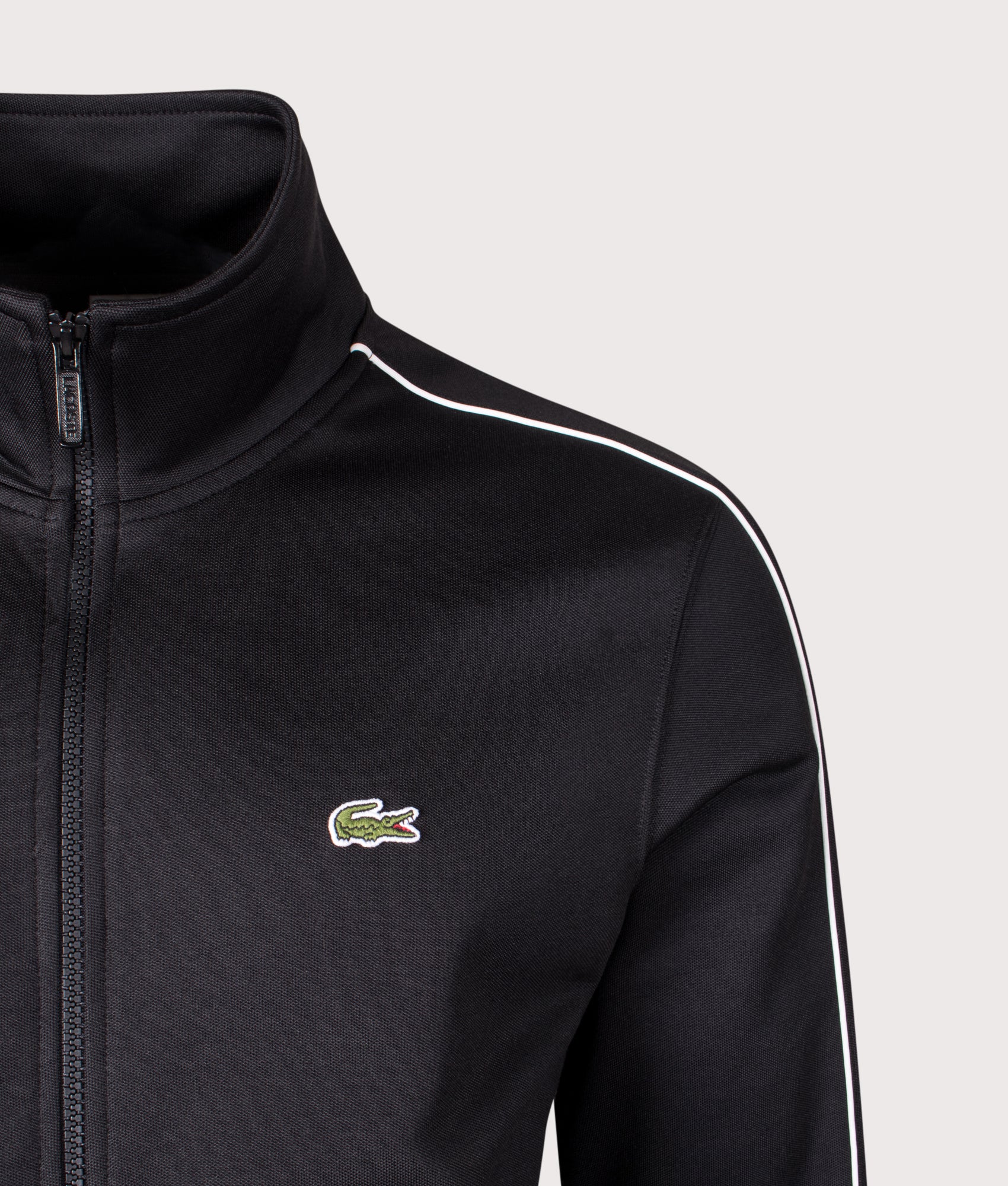 Paris Piqué Zip Front Track Jacket in Black | Lacoste | EQVVS | Front detail shot 