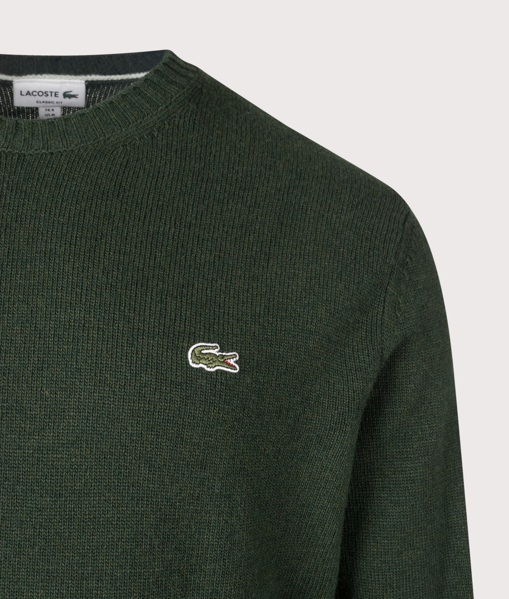 Lacoste Classic Fit Wool Crewneck Jumper in Sinople Green at EQVVS Menswear. Detail shot.