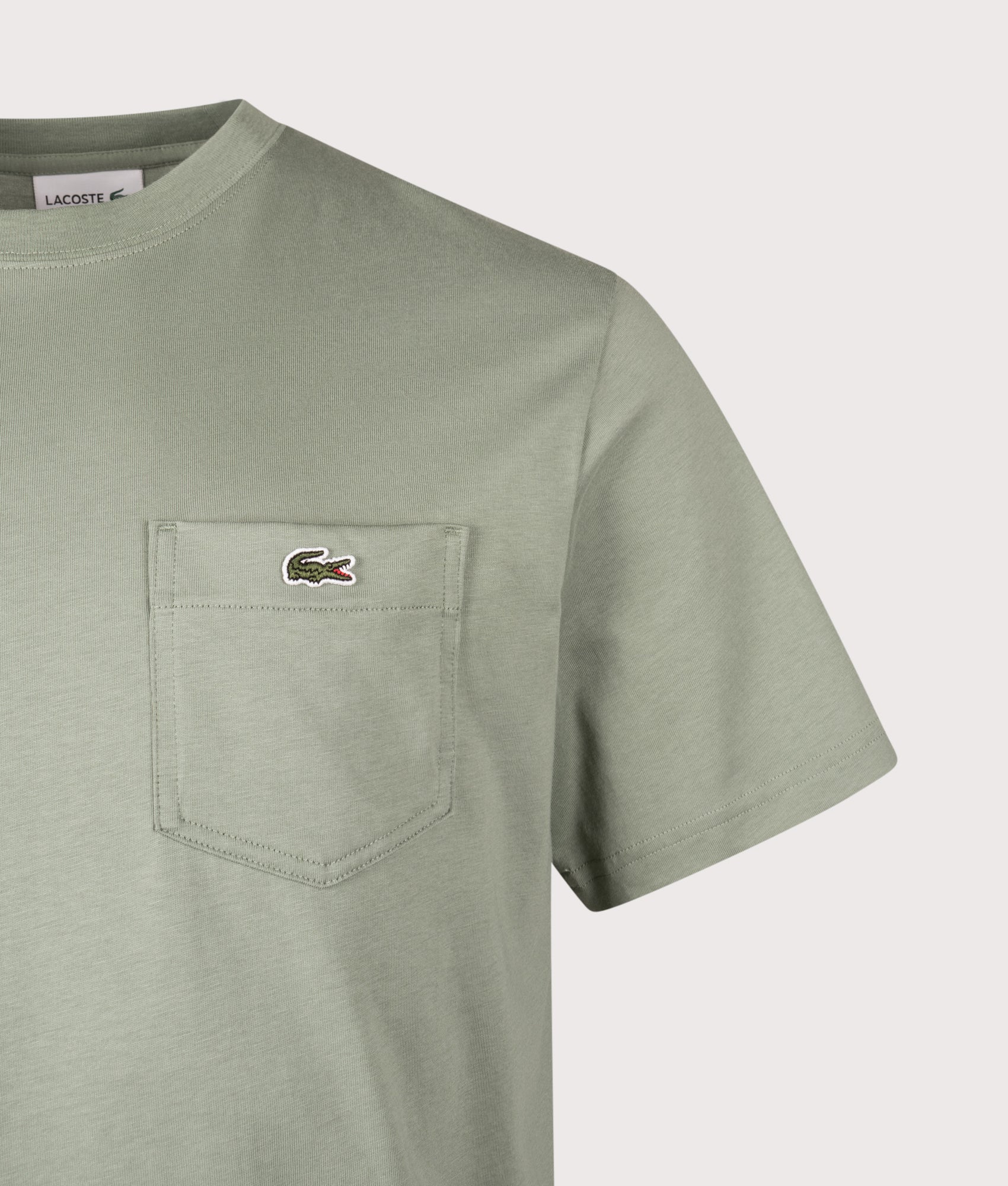 Cotton T-Shirt with Breast Pocket by Lacoste in Thyme. Shot by EQVVS. Detail shot.