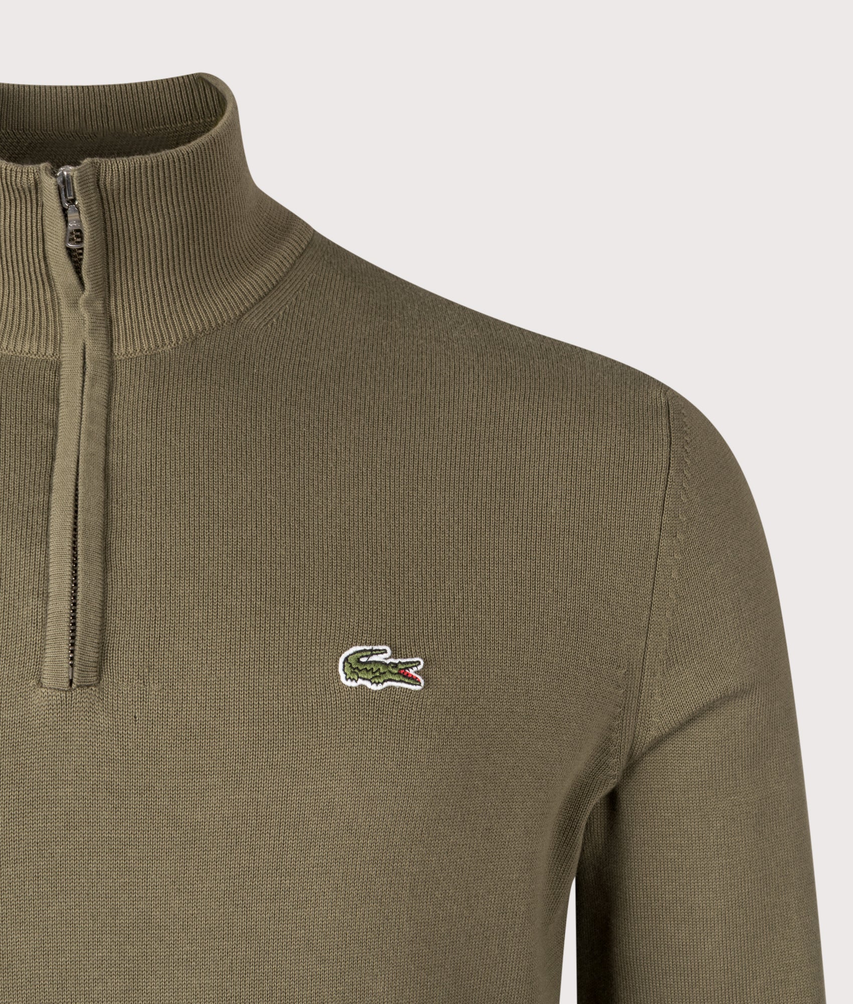 Lacoste Zip Through High Neck Sweatshirt in Khaki Green at EQVVS Menswear. Detail shot.