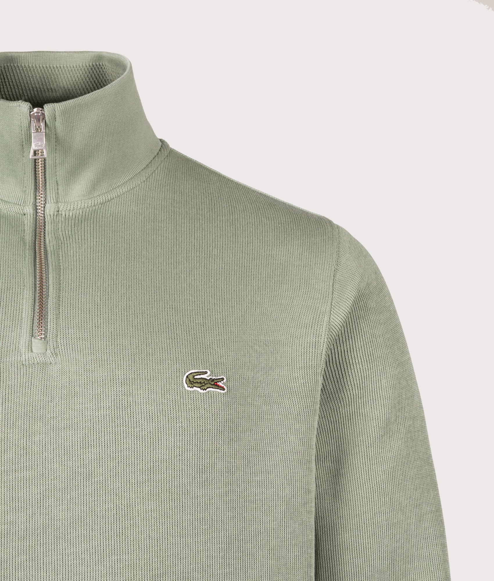 Quarter Zip Sweatshirt by Lacoste in Thyme. Shot by EQVVS. Front detail shot.