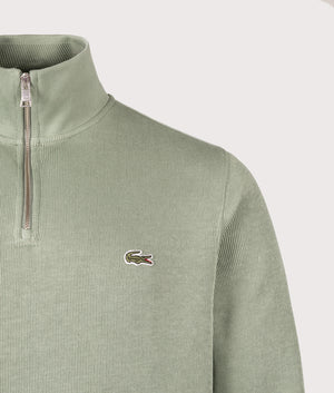 Quarter Zip Sweatshirt by Lacoste in Thyme. Shot by EQVVS. Front detail shot.