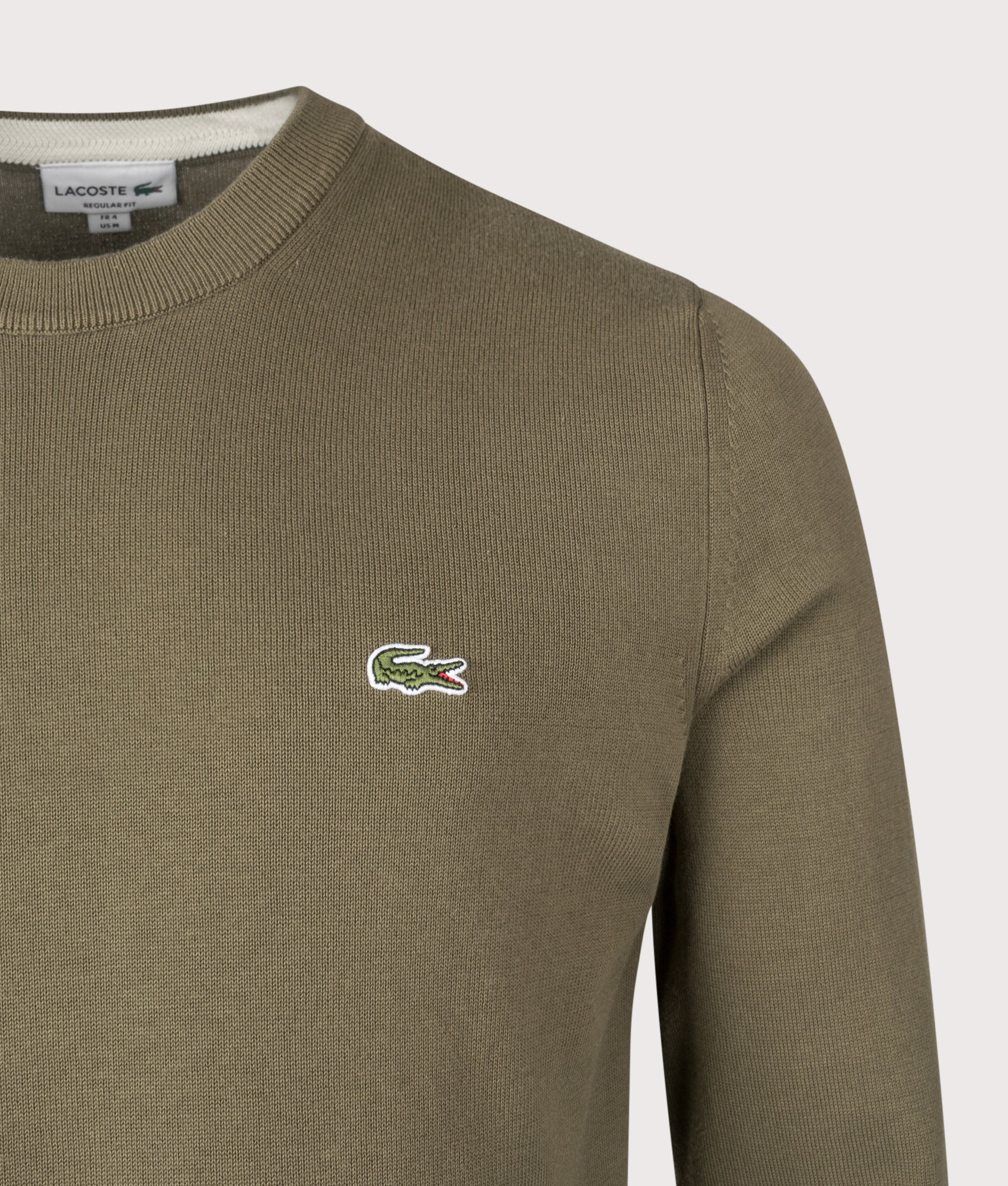 Lacoste Monochrome Crew Neck Cotton Sweatshirt in Khaki Green at EQVVS Menswear. Detail shot.