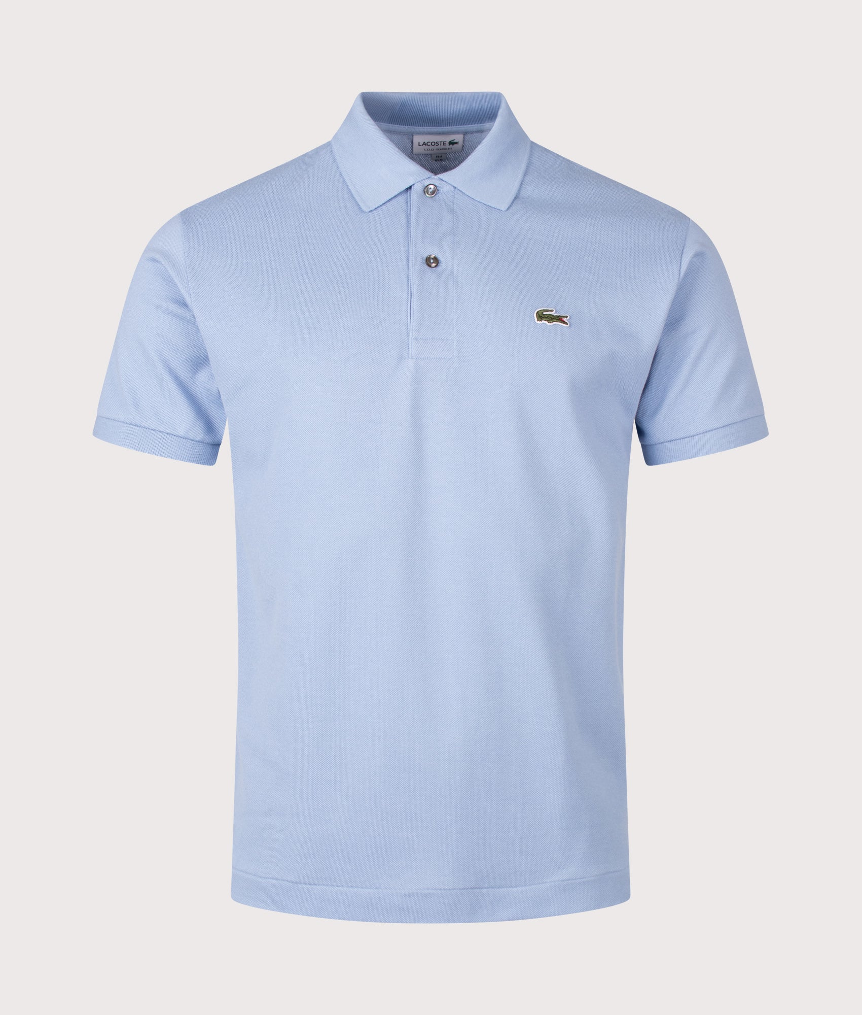 Lacoste Classic Fit L1212 Croc Logo Polo Shirt in Light Blue at EQVVS Menswear. Front shot.