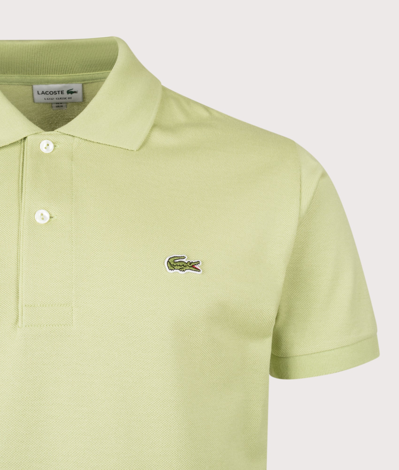 Lacoste Classic Fit L1212 Croc Logo Polo Shirt in Birch at EQVVS Menswear. Detail shot.