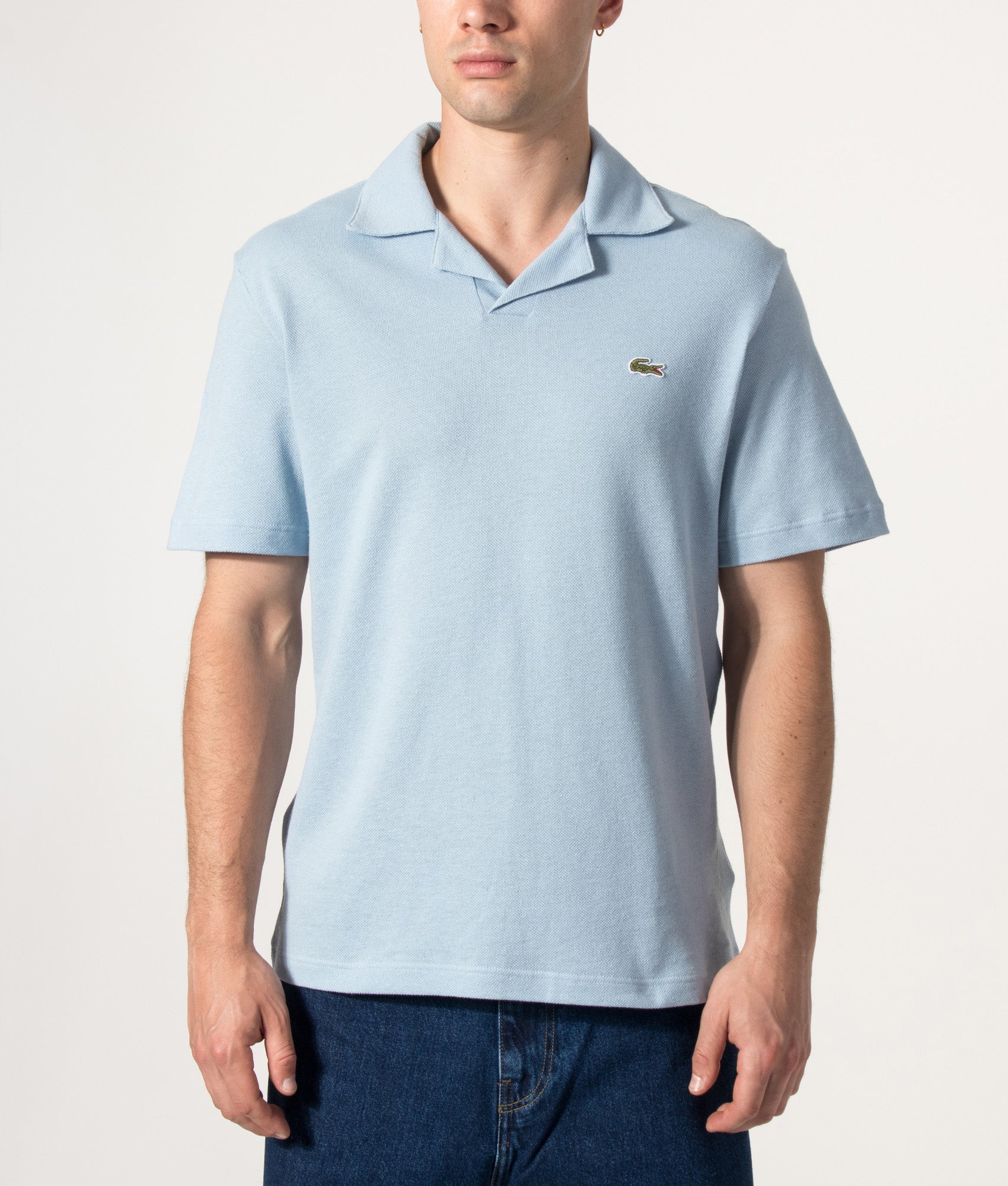 Lacoste Cotton-Linen Polo Shirt in Chambray at EQVVS Menswear. Model front shot.