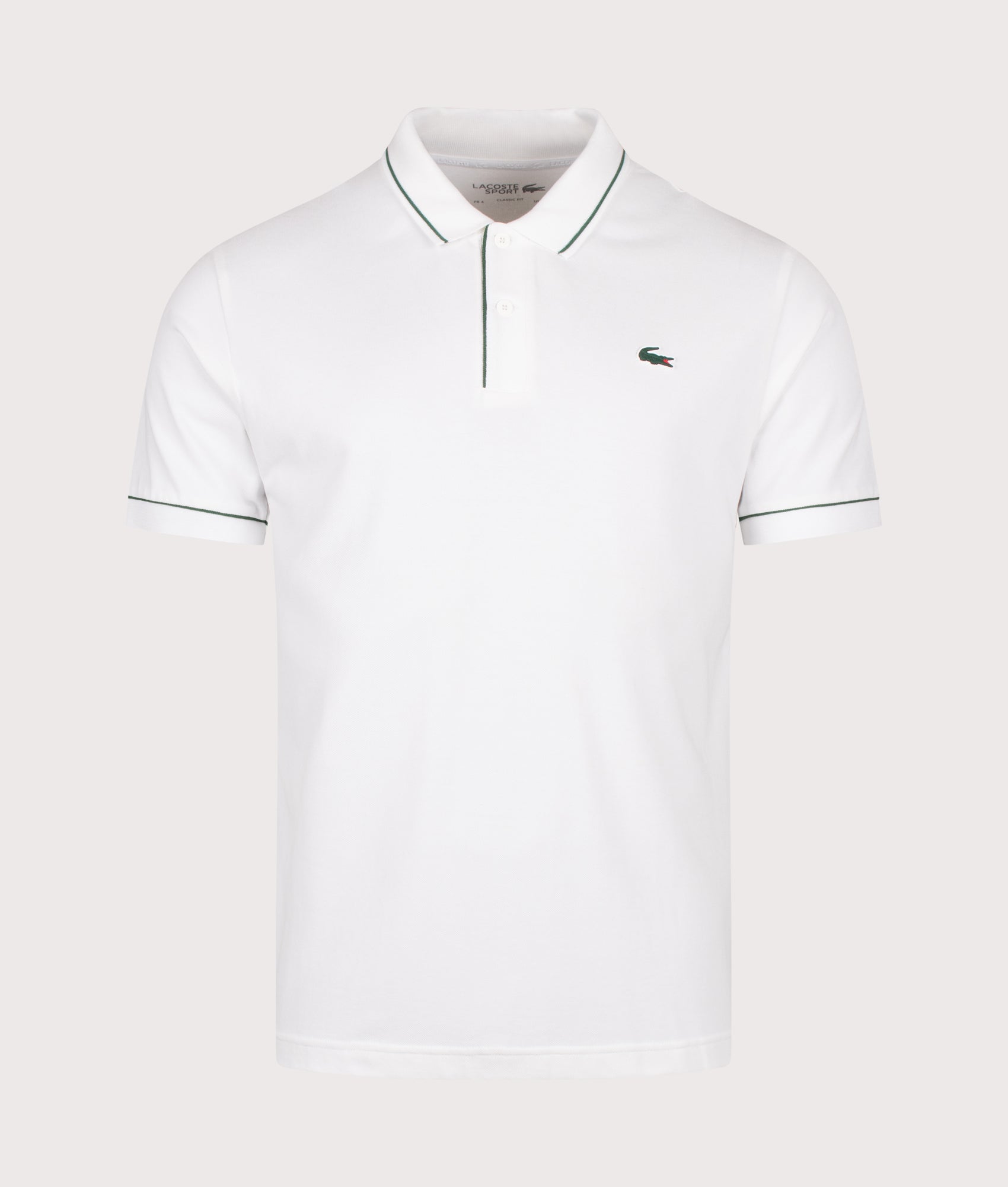 Lacoste Classic Fit Heat Regulating Mini Piqué Golf Polo Shirt in White at EQVVS Menswear. Front shot. 