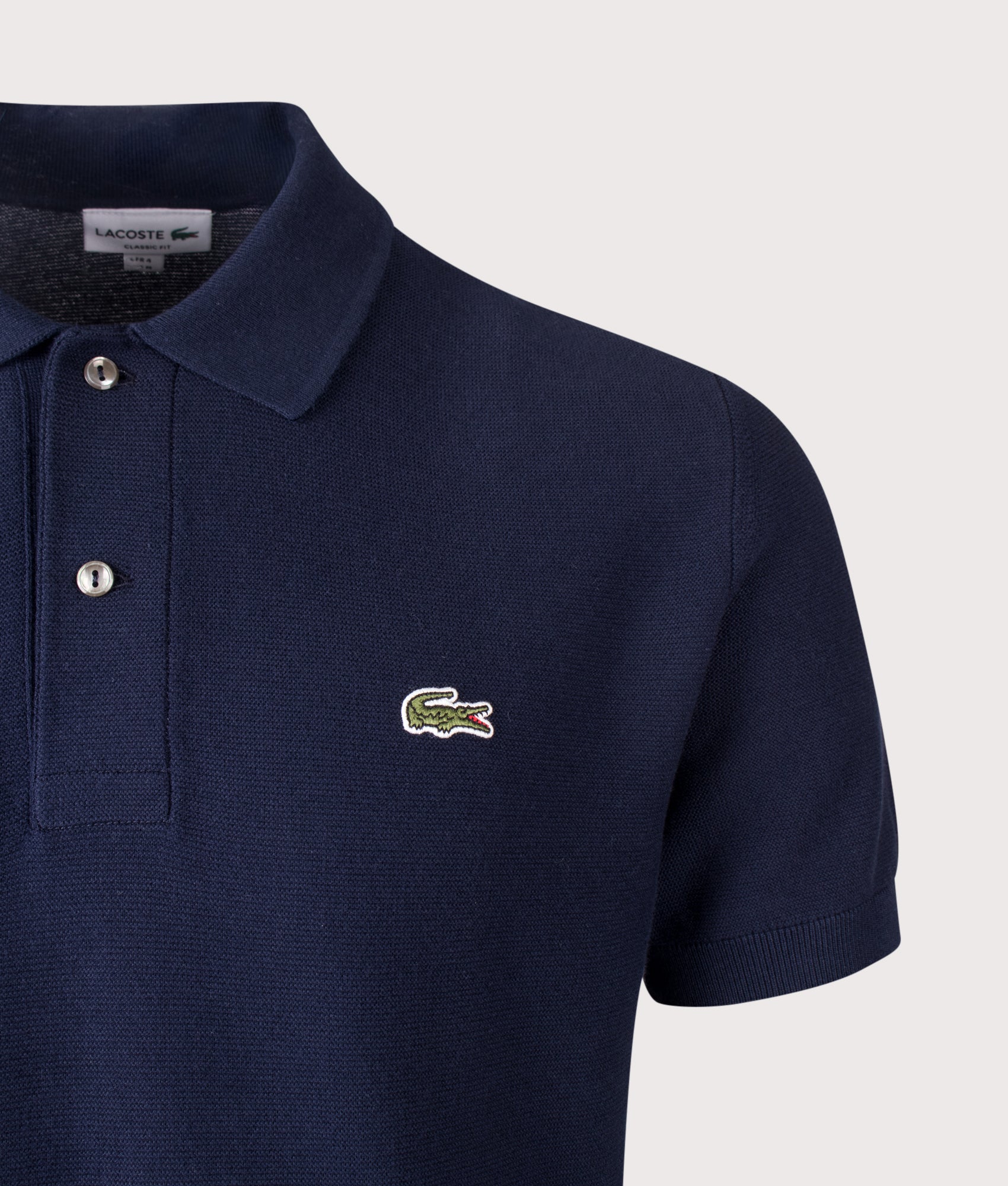 Lacoste Classic Fit Knitted Polo Shirt in Navy Blue at EQVVS Menswear. Detail shot.