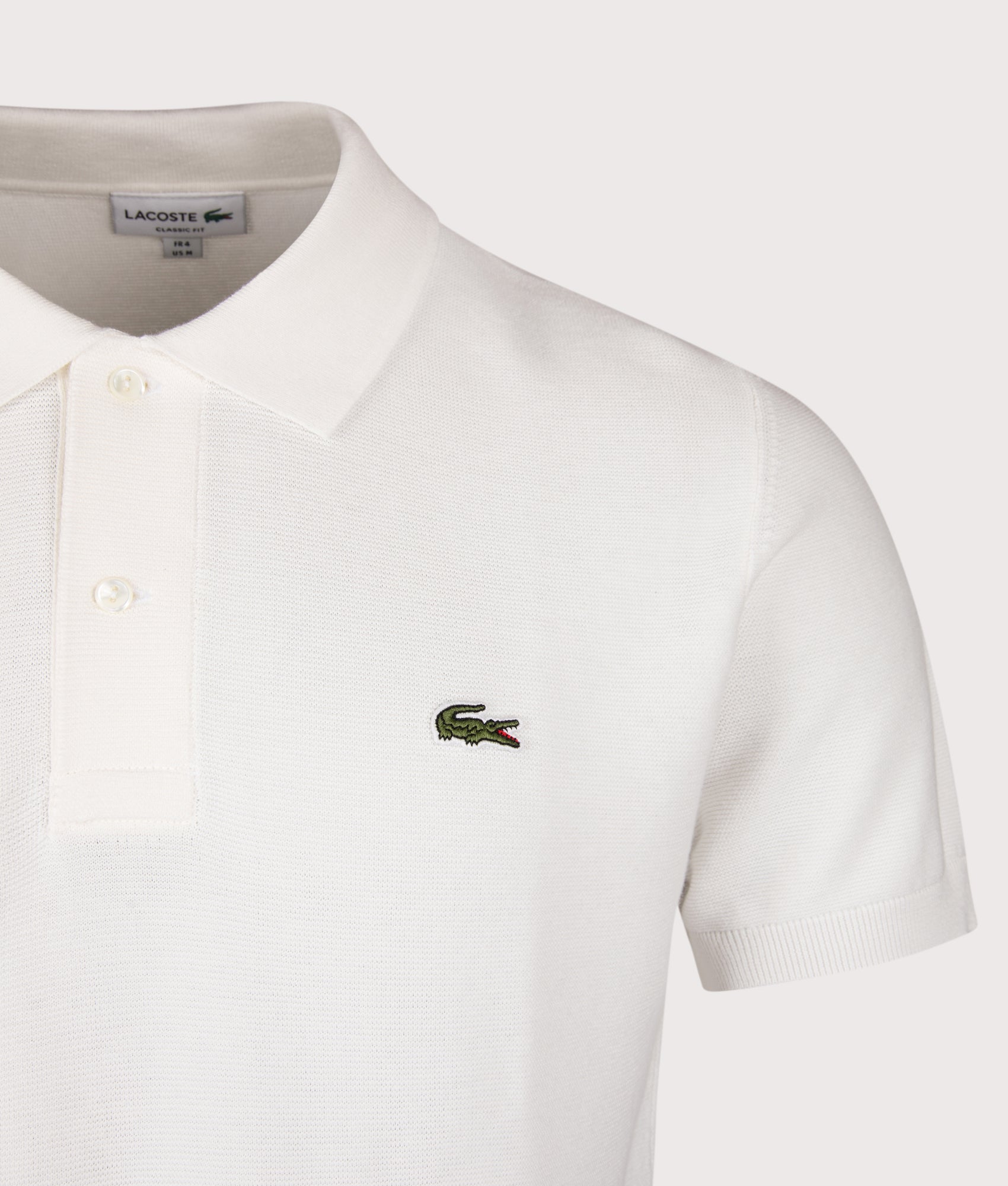 Classic Fit L1212 Croc Logo Polo Shirt in Flour by Lacoste. Shot by EQVVS. Detail shot.