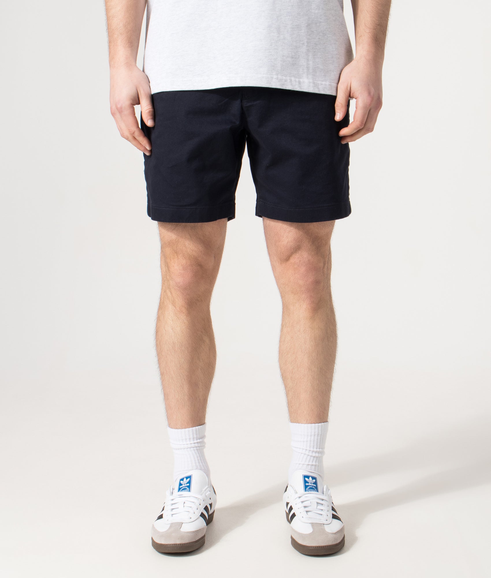 Lacoste Regular Fit Stretch Cotton Chino Shorts in Abysm at EQVVS Menswear. Model front shot.