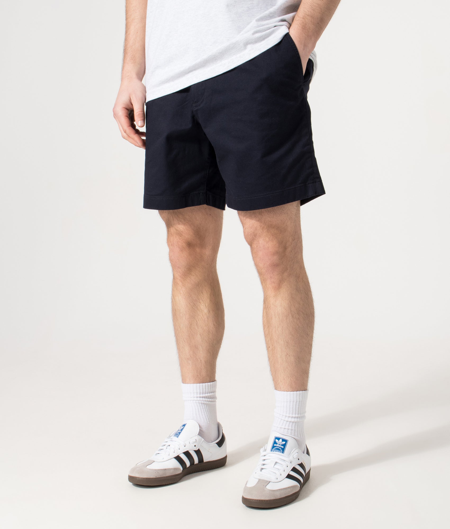 Lacoste Regular Fit Stretch Cotton Chino Shorts in Abysm at EQVVS Menswear. Model front shot.