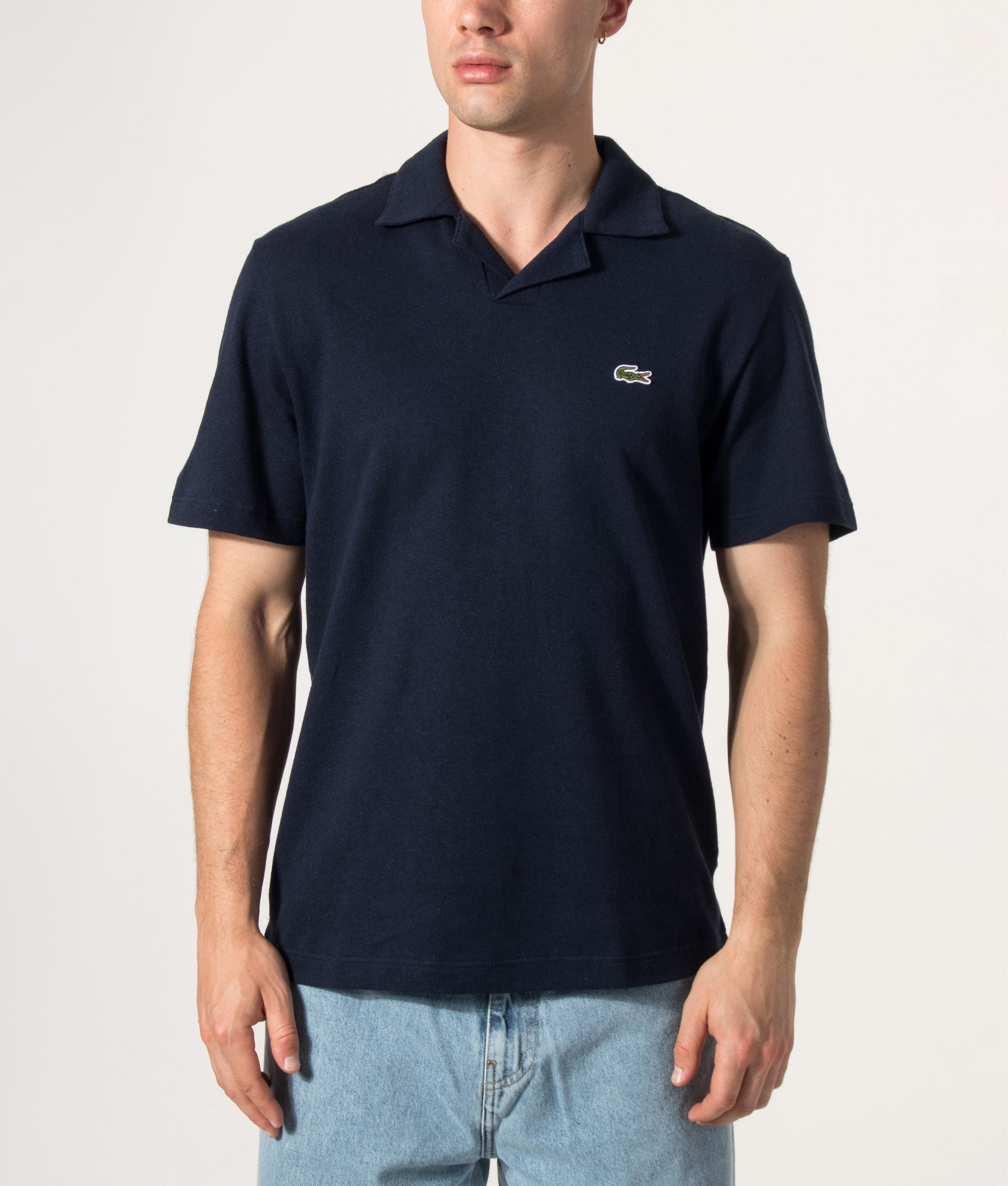 Lacoste Cotton-Linen Polo Shirt in Navy Blue at EQVVS Menswear. Model front shot.