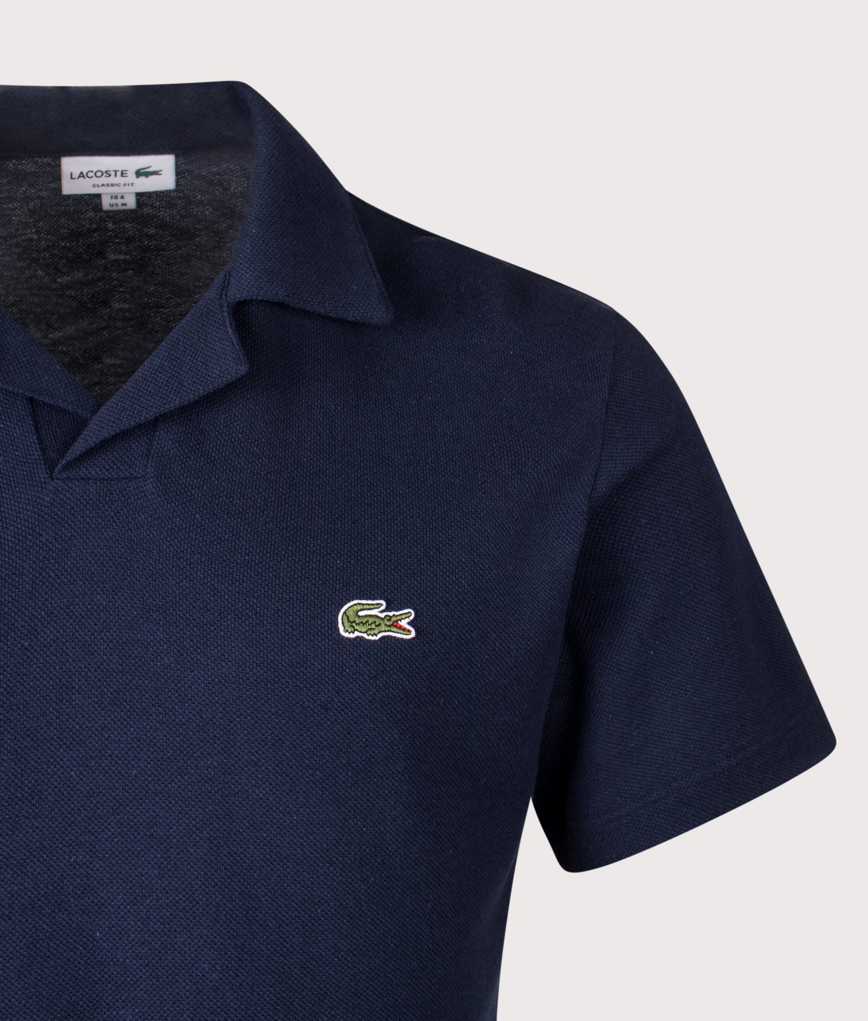 Lacoste Cotton-Linen Polo Shirt in Navy Blue at EQVVS Menswear. Detail shot.