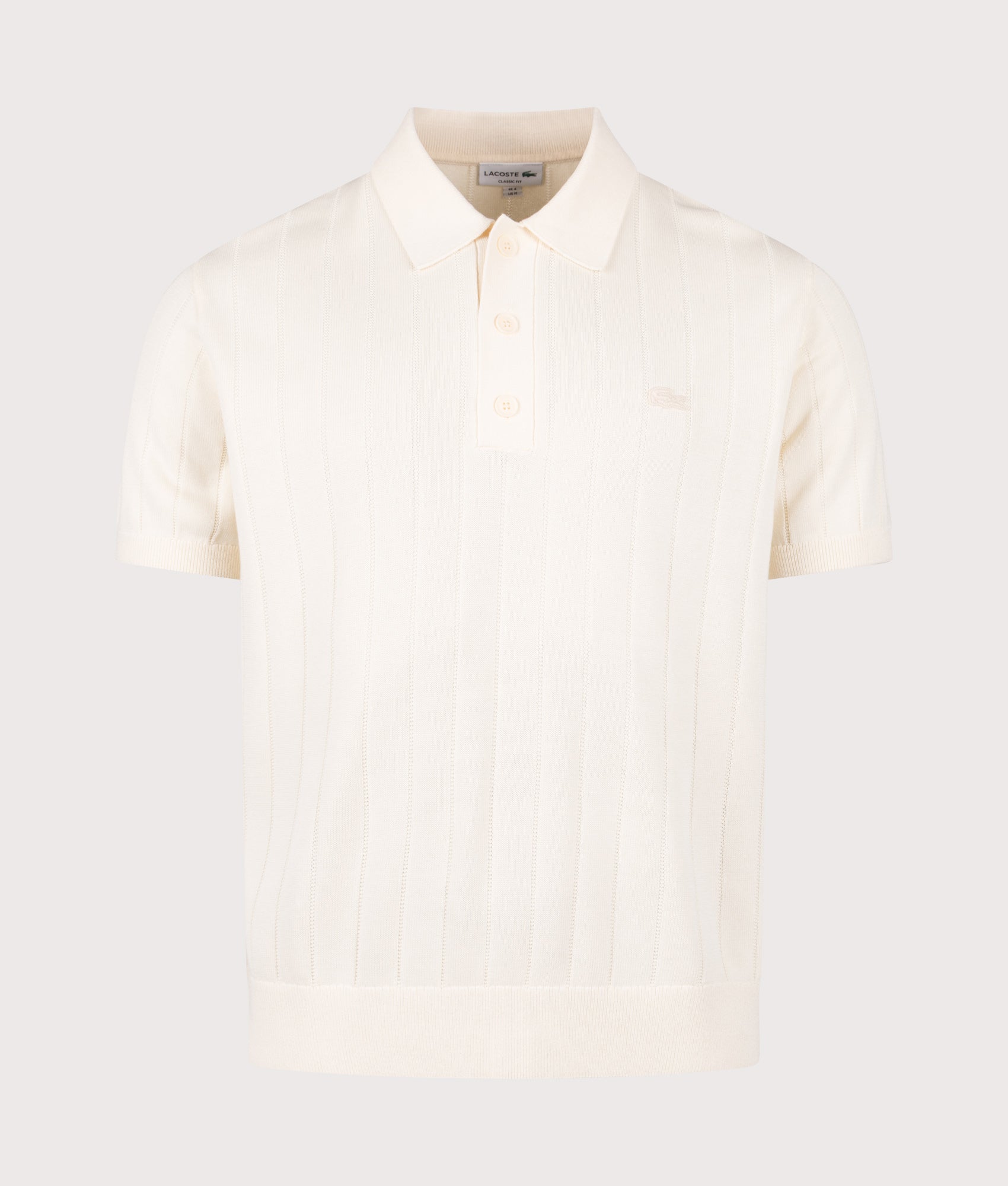 Lacoste Fluid Ribbed Knit Polo Shirt in Naturel Clair at EQVVS Menswear. Front shot.