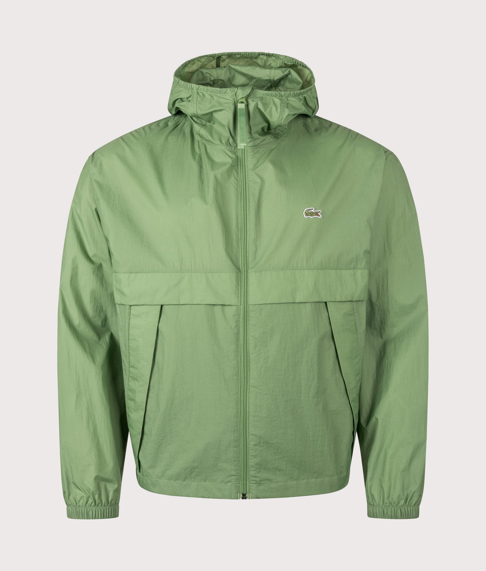 Lacoste Lightweight Packable Jacket in Green at EQVVS Menswear. Front shot.