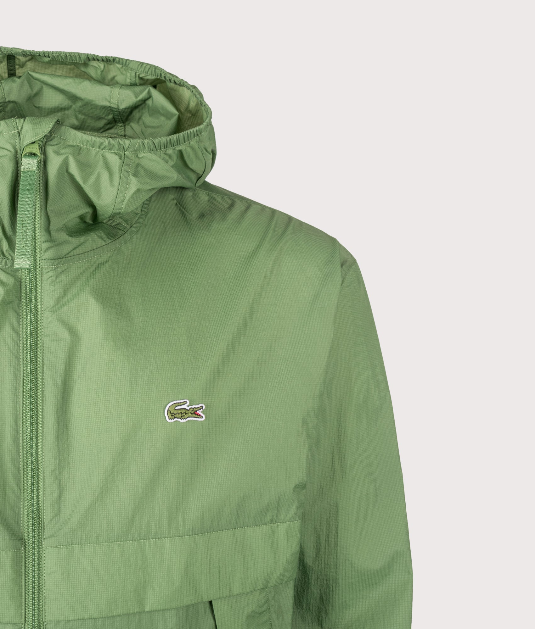 Lacoste Lightweight Packable Jacket in Green at EQVVS Menswear. Detail shot.