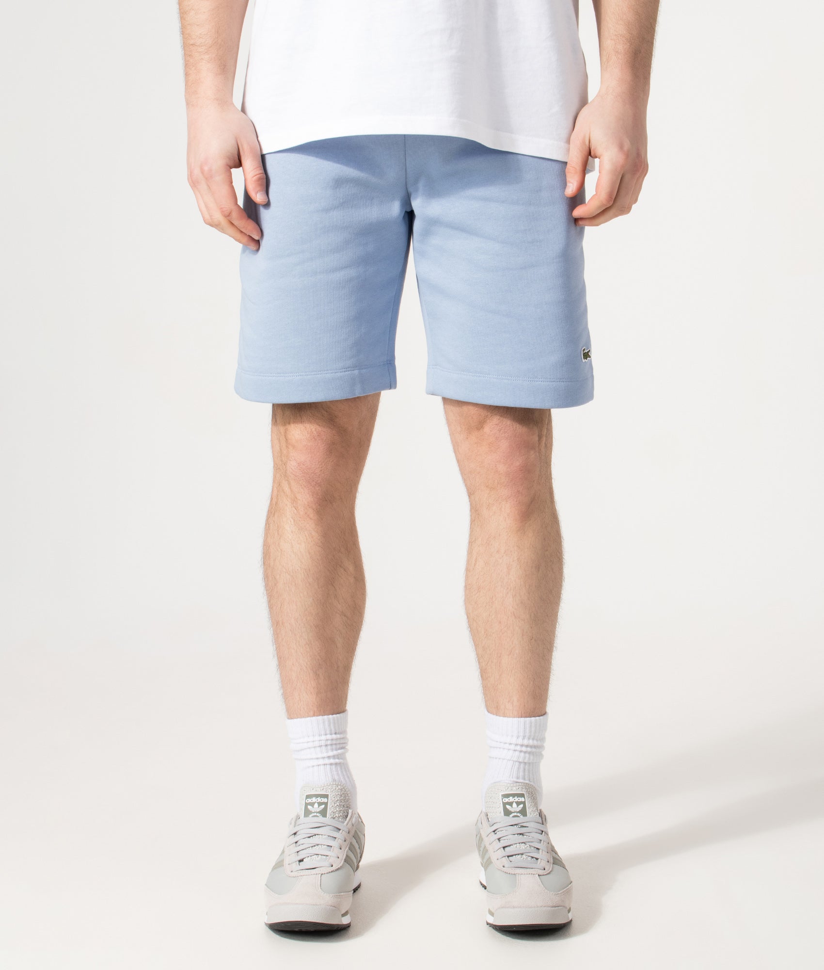 Lacoste Regular Fit Logo Sweat Shorts in Aphylla Blue at EQVVS Menswear. Model front shot.