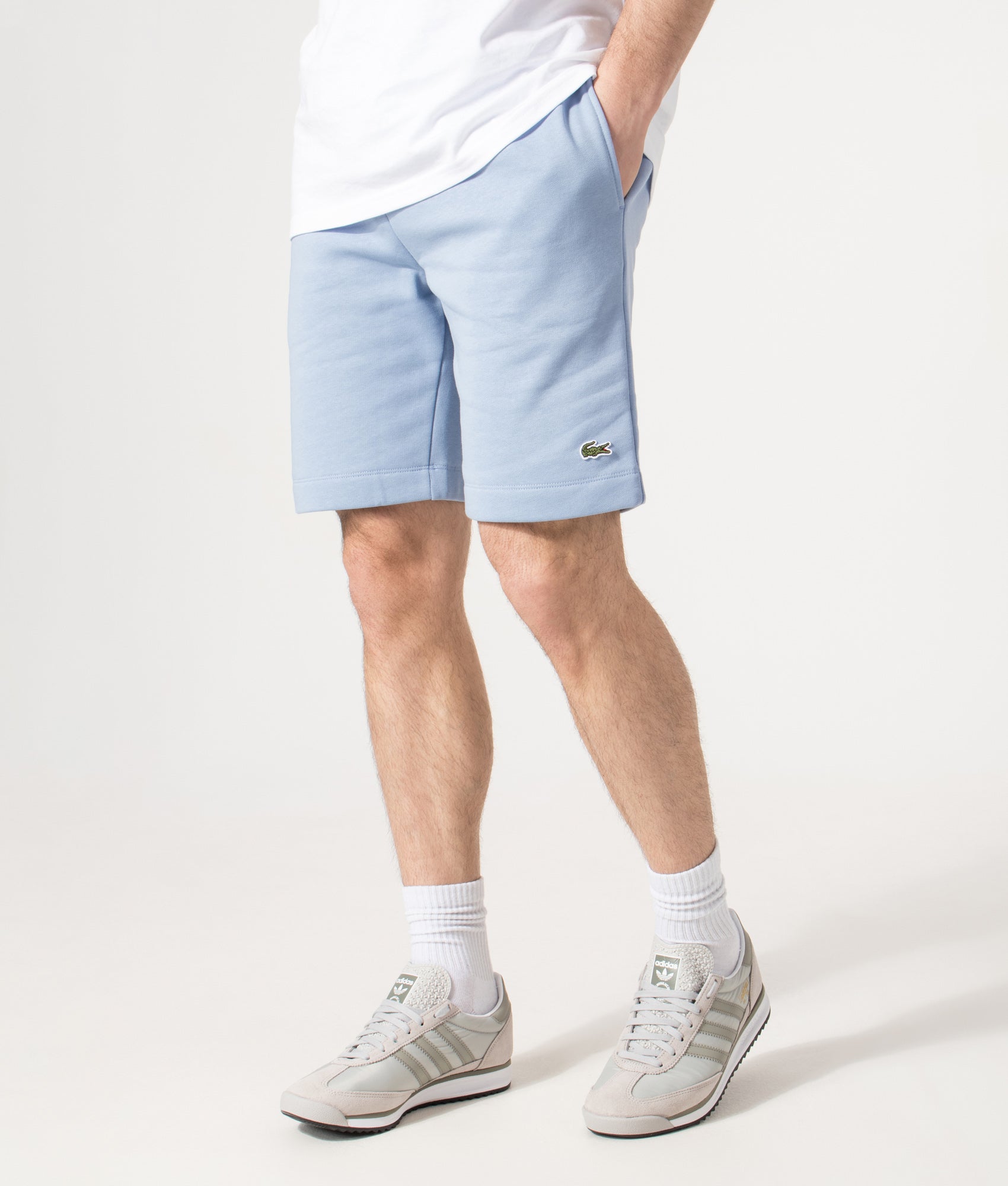 Lacoste Regular Fit Logo Sweat Shorts in Aphylla Blue at EQVVS Menswear. Angled model front shot.