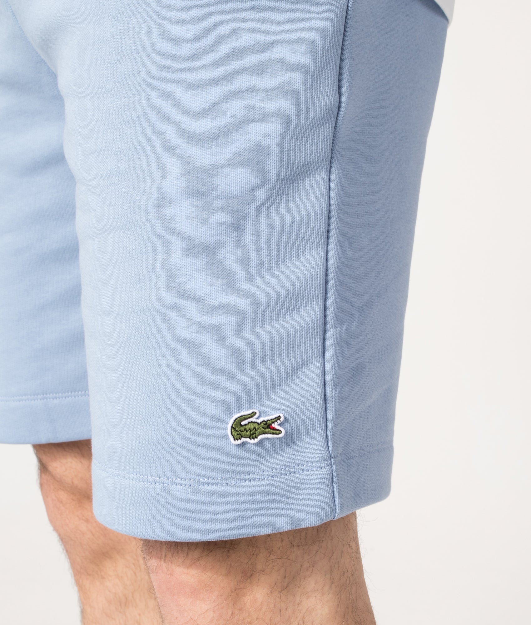 Lacoste Regular Fit Logo Sweat Shorts in Aphylla Blue at EQVVS Menswear. Detail shot.