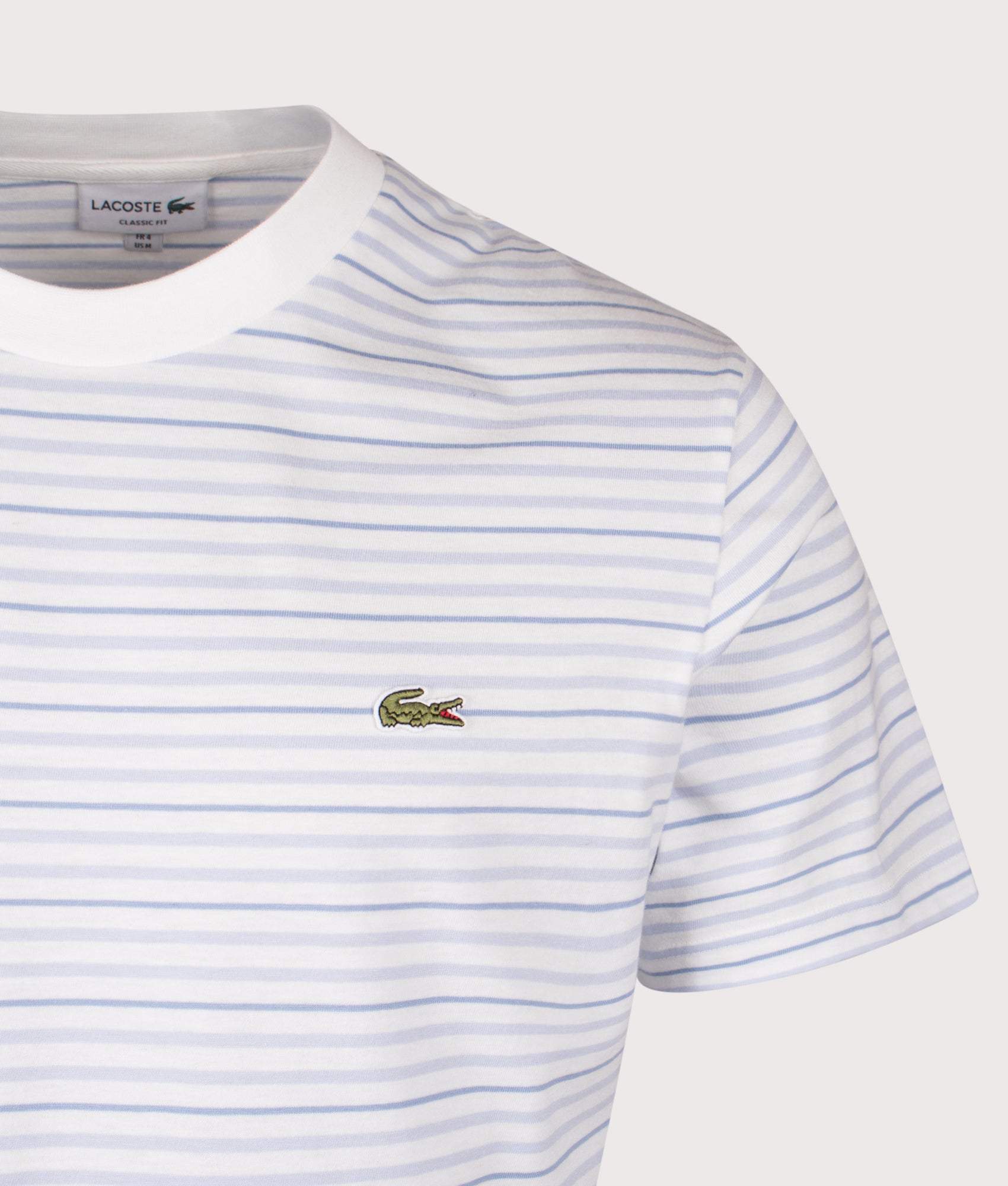 Lacoste Striped T-Shirt in Phoenix Blue and Flour at EQVVS Menswear. Detail shot.