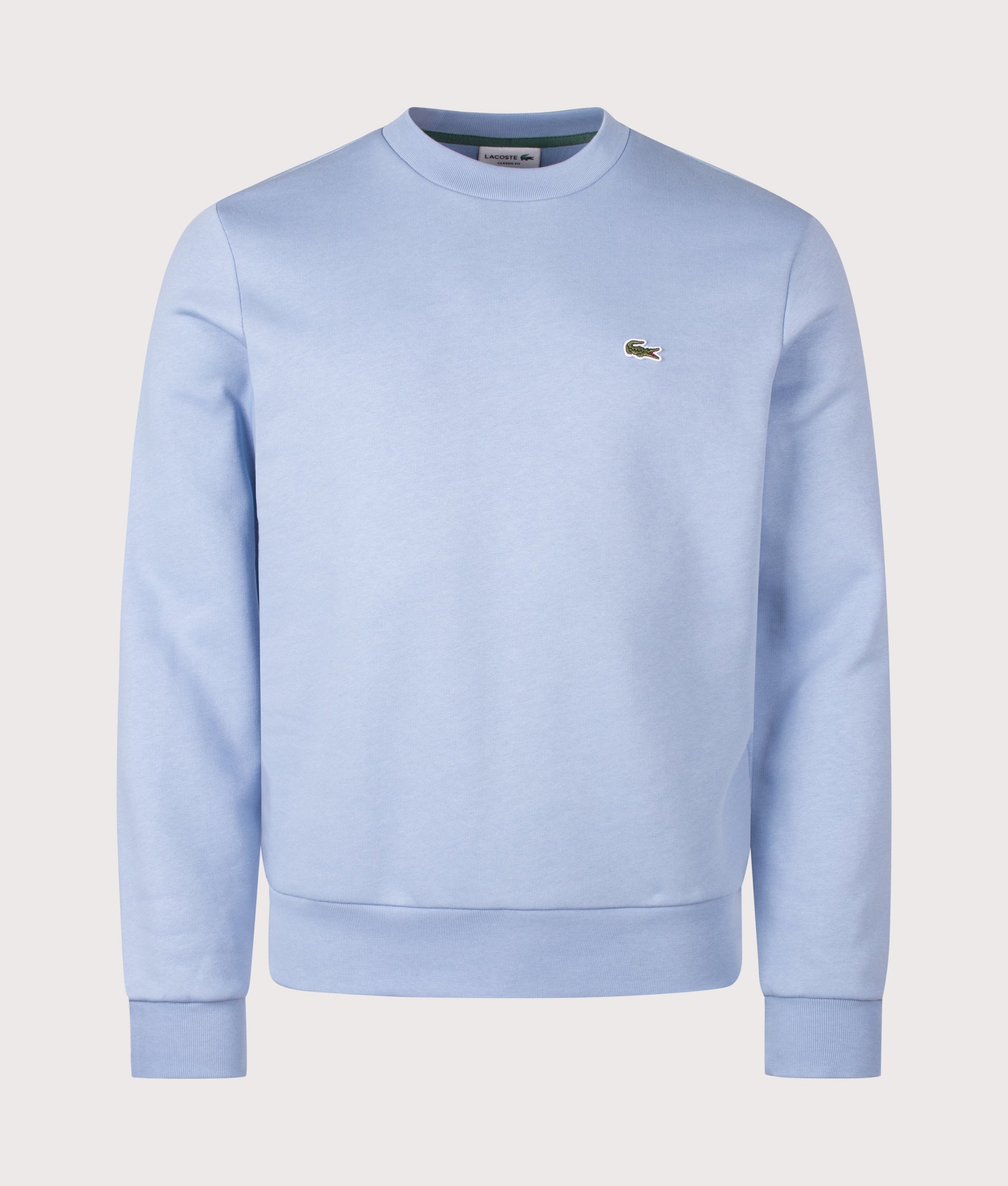 Lacoste Relaxed Fit Brushed Cotton Sweatshirt in Light Blue at EQVVS Menswear. Front shot.