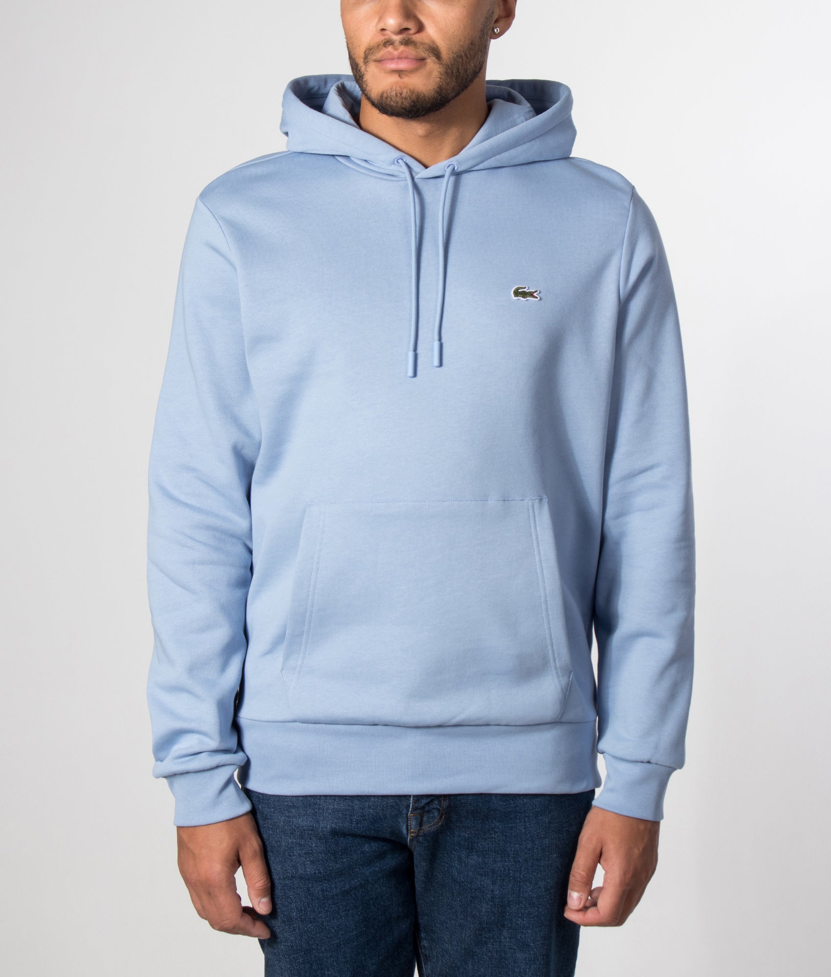 Lacoste Relaxed Fit Brushed Fleece Hoodie in Aphylla at EQVVS Menswear. Model front shot.