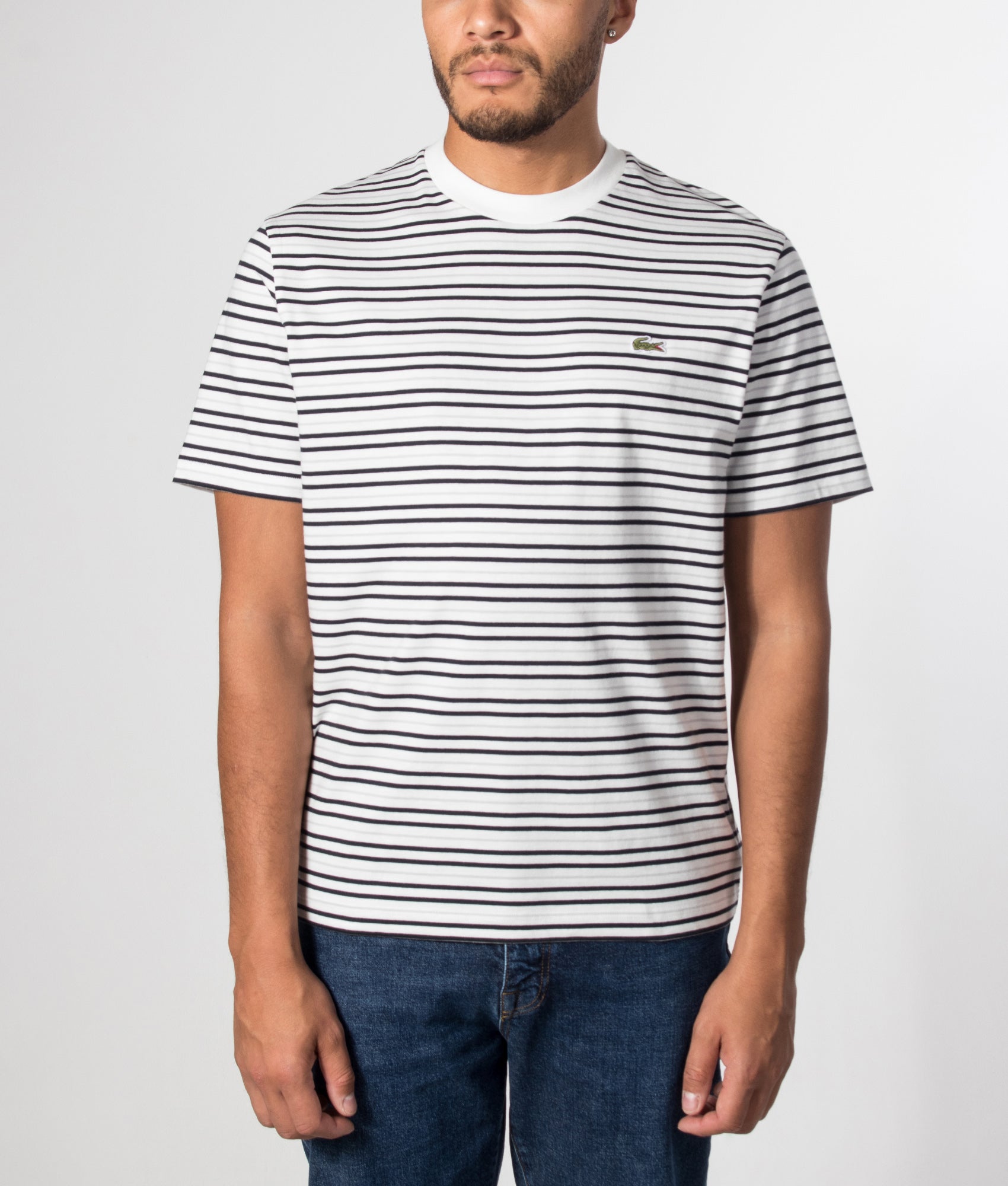 Lacoste Regular Fit Striped T-Shirt in Blue at EQVVS Menswear. Model front shot.