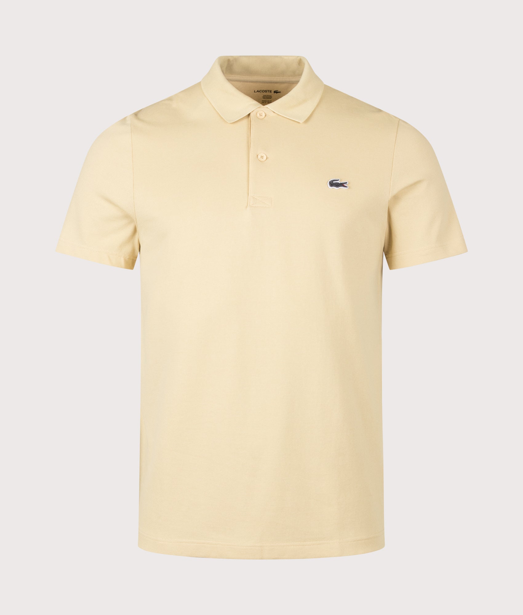 Lacoste Regular Fit Cotton Blend Polo Shirt in Beige at EQVVS Menswear. Front shot.