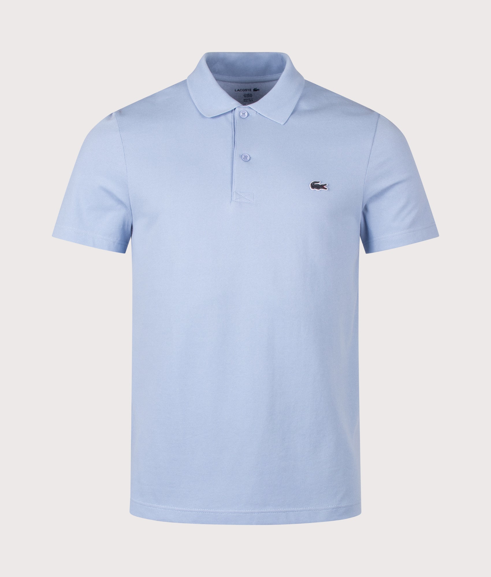 Lacoste Regular Fit Cotton Blend Polo Shirt in Light Blue at EQVVS Menswear. Front shot.