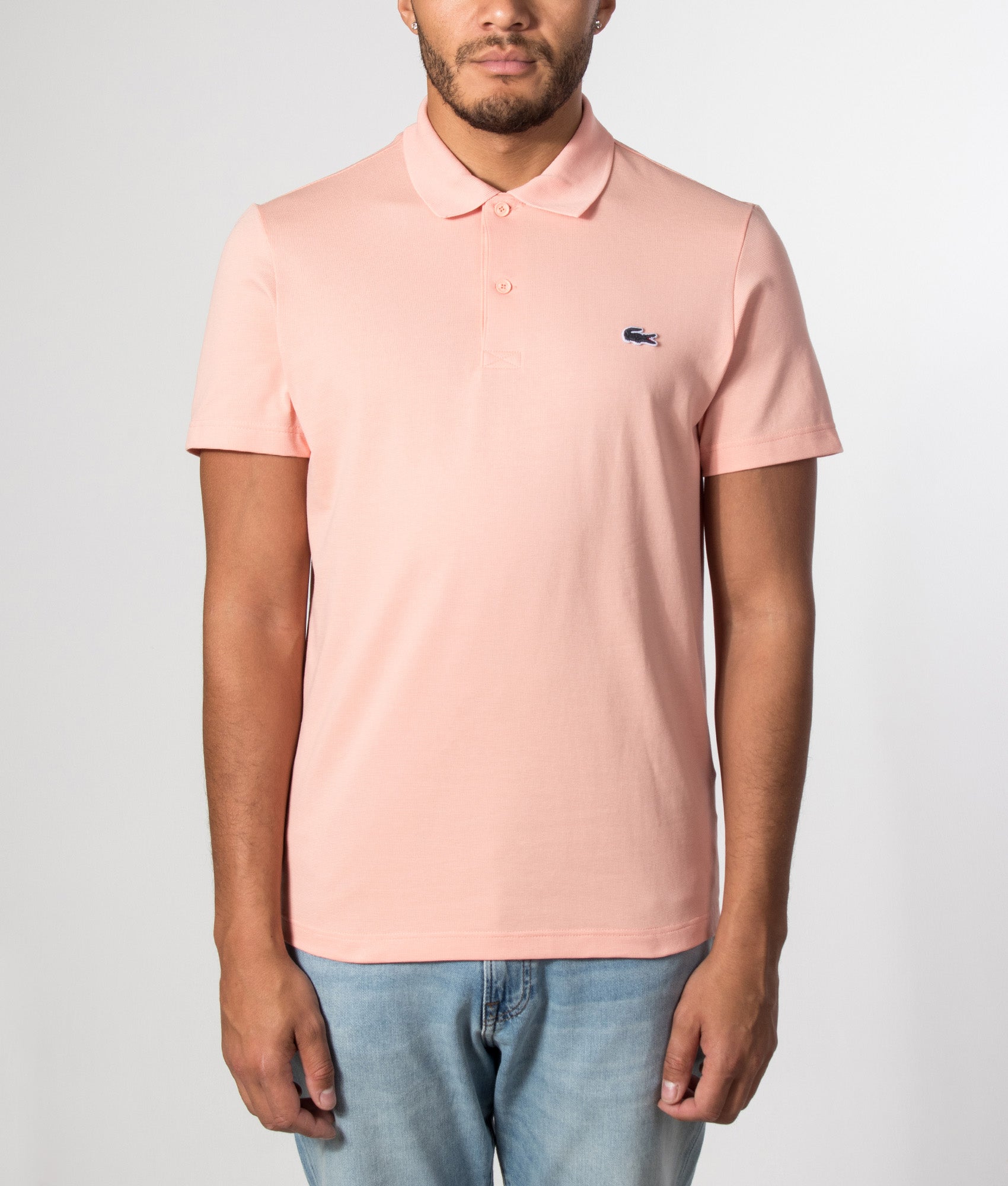 Lacoste Regular Fit Cotton Blend Polo Shirt in Miami at EQVVS Menswear. Model front shot.