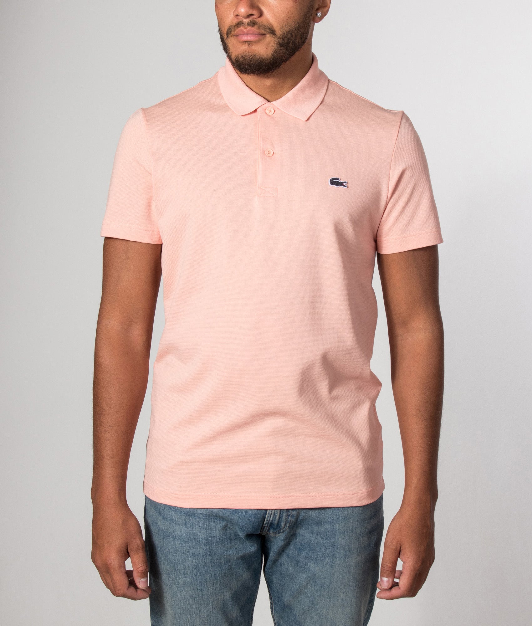 Lacoste Regular Fit Cotton Blend Polo Shirt in Miami at EQVVS Menswear. Model front shot.