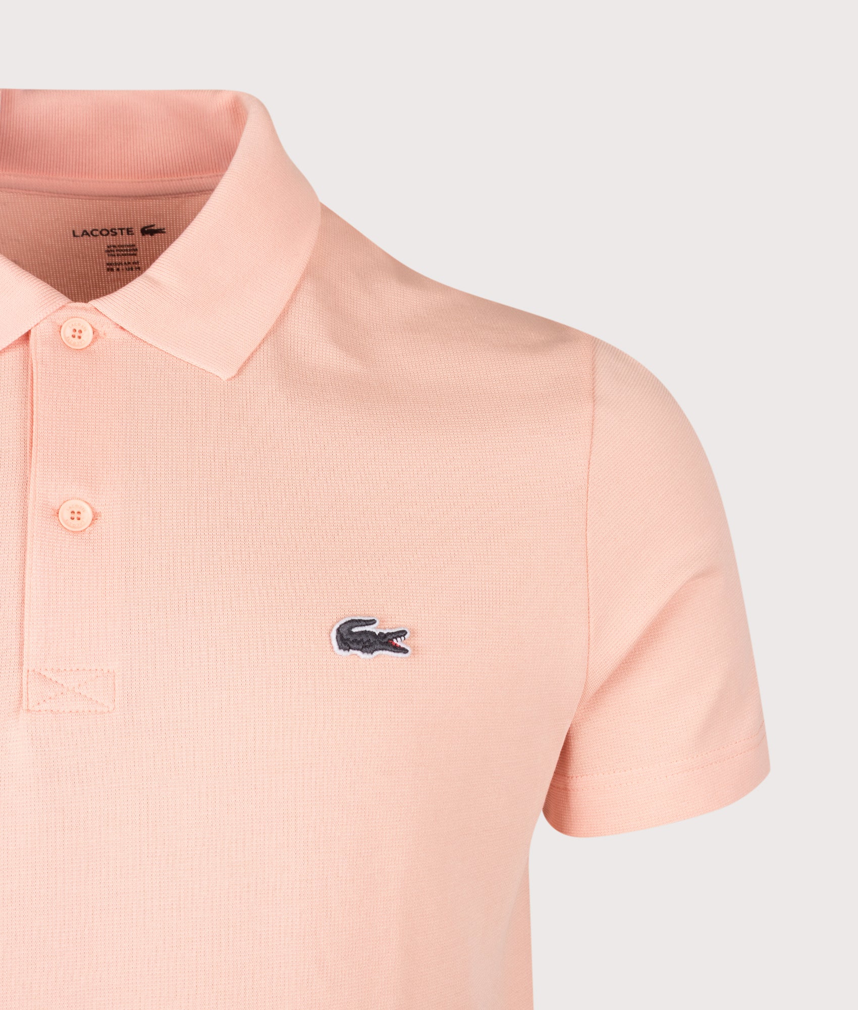 Lacoste Regular Fit Cotton Blend Polo Shirt in Miami at EQVVS Menswear. Detail shot.