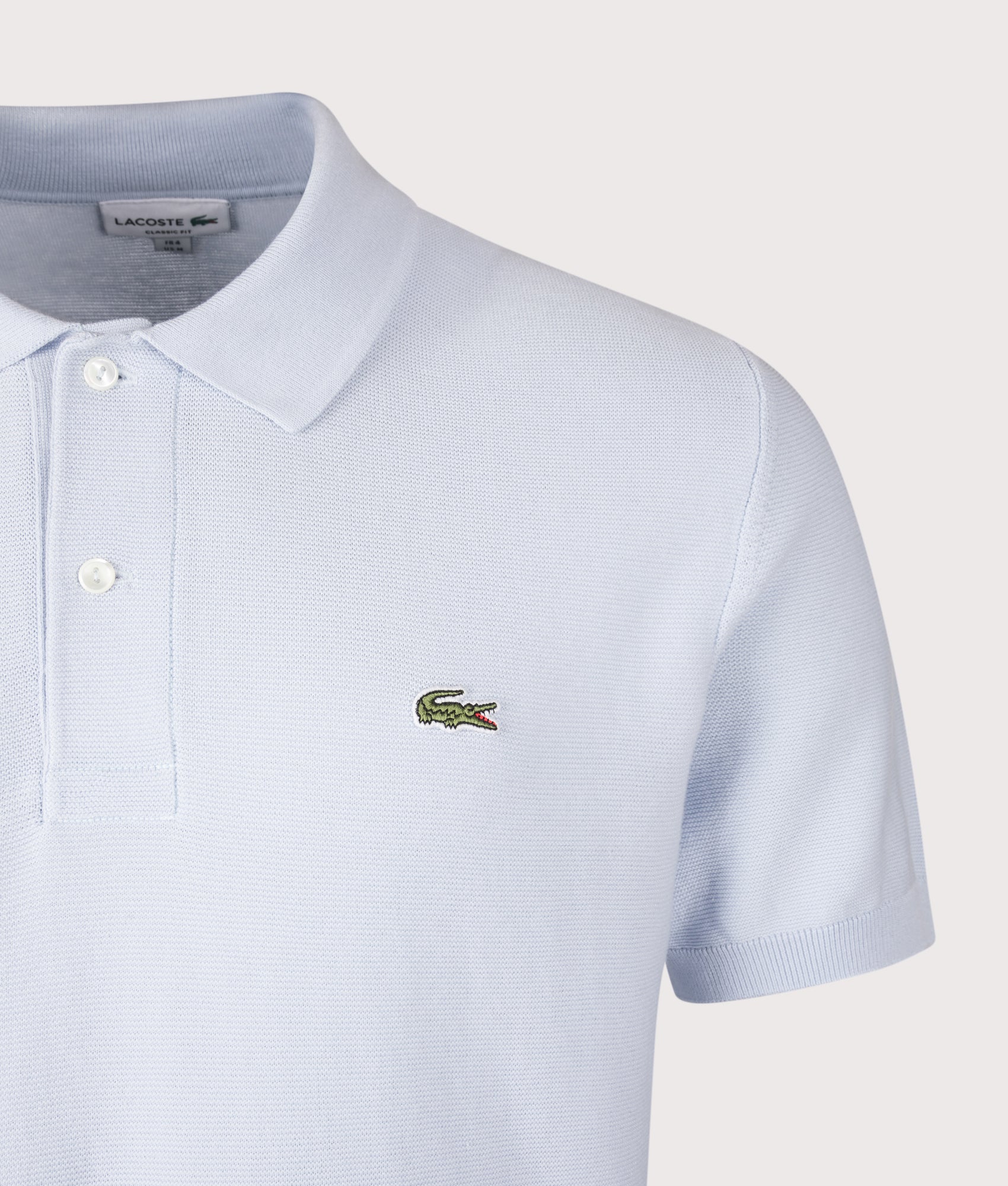 Classic Fit L1212 Croc Logo Polo Shirt in Phoenix Blue by Lacoste. Shot by EQVVS. Detail Shot.