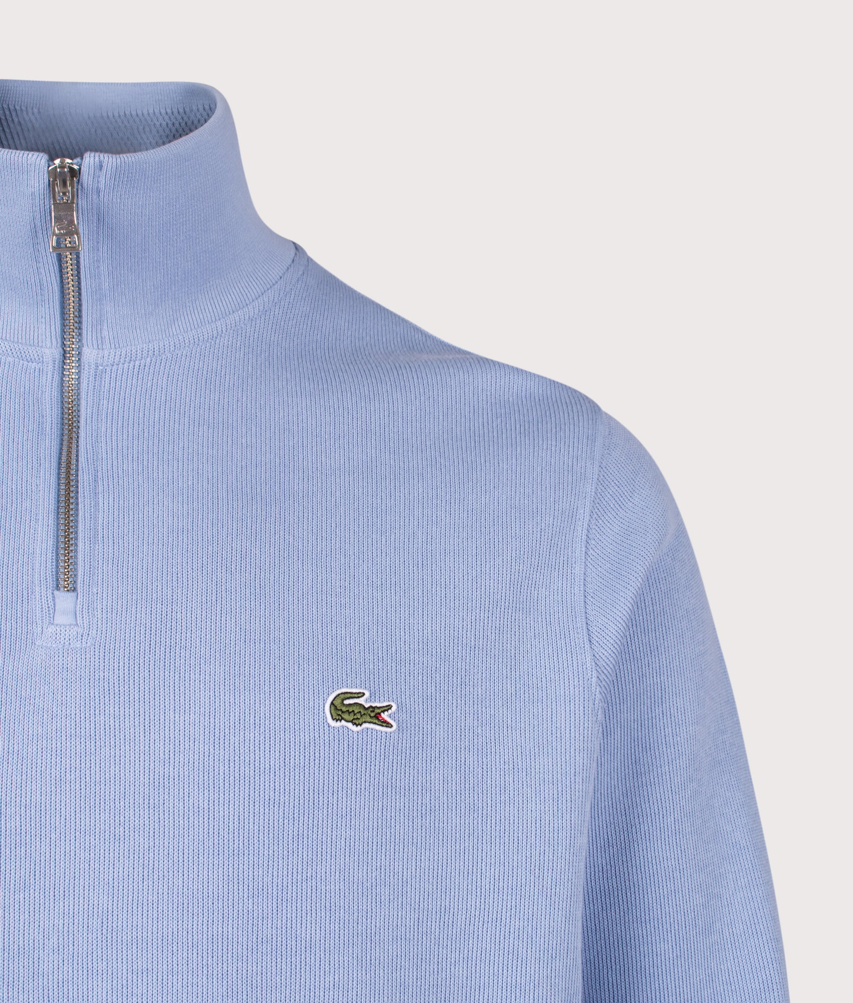 Lacoste Quarter Zip Croc Logo Sweatshirt in Aphylla at EQVVS Menswear. Detail shot.