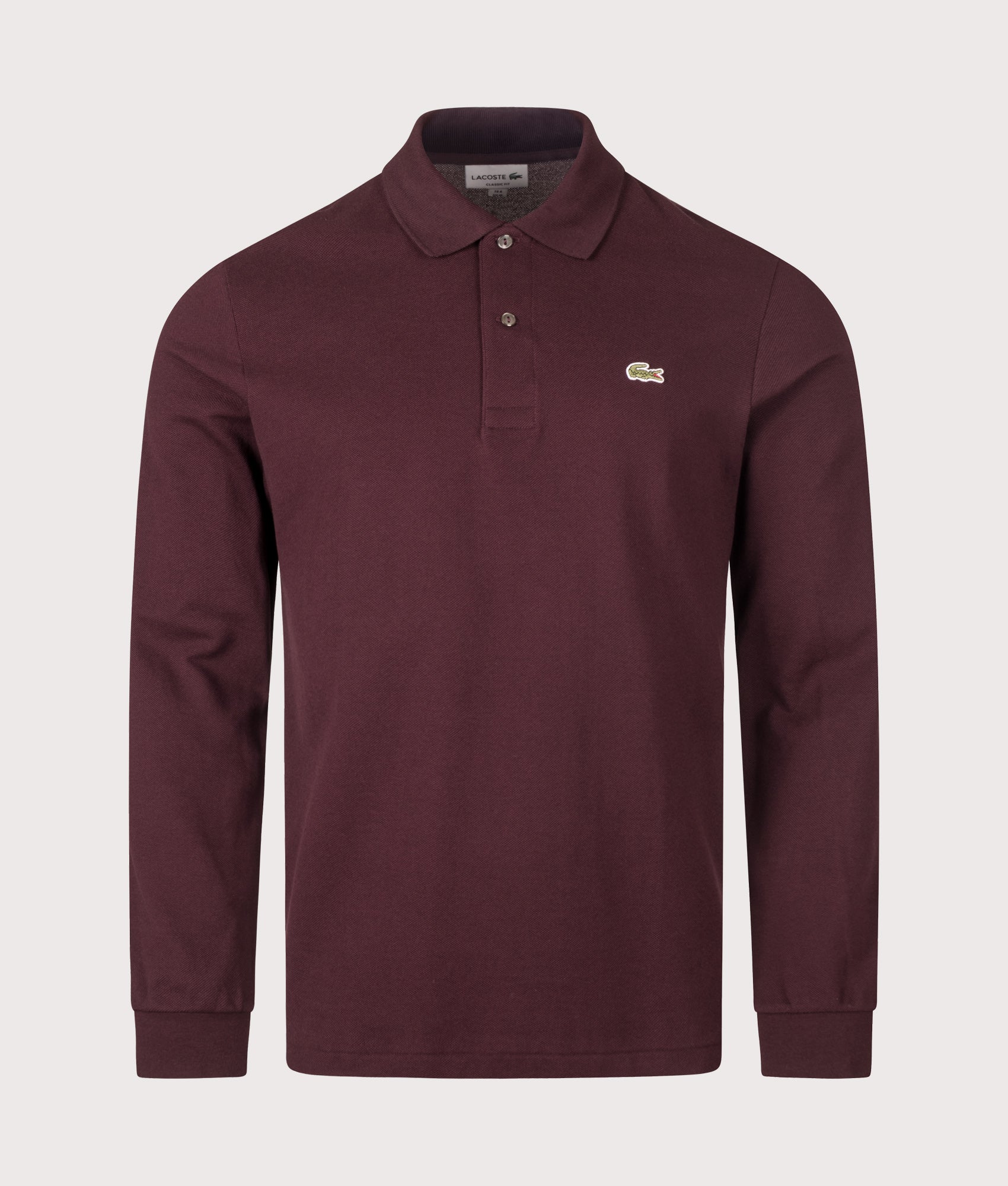 Lacoste Classic Fit Long Sleeve Croc Logo Polo Shirt in Chestnut Brown at EQVVS Menswear. Front shot.