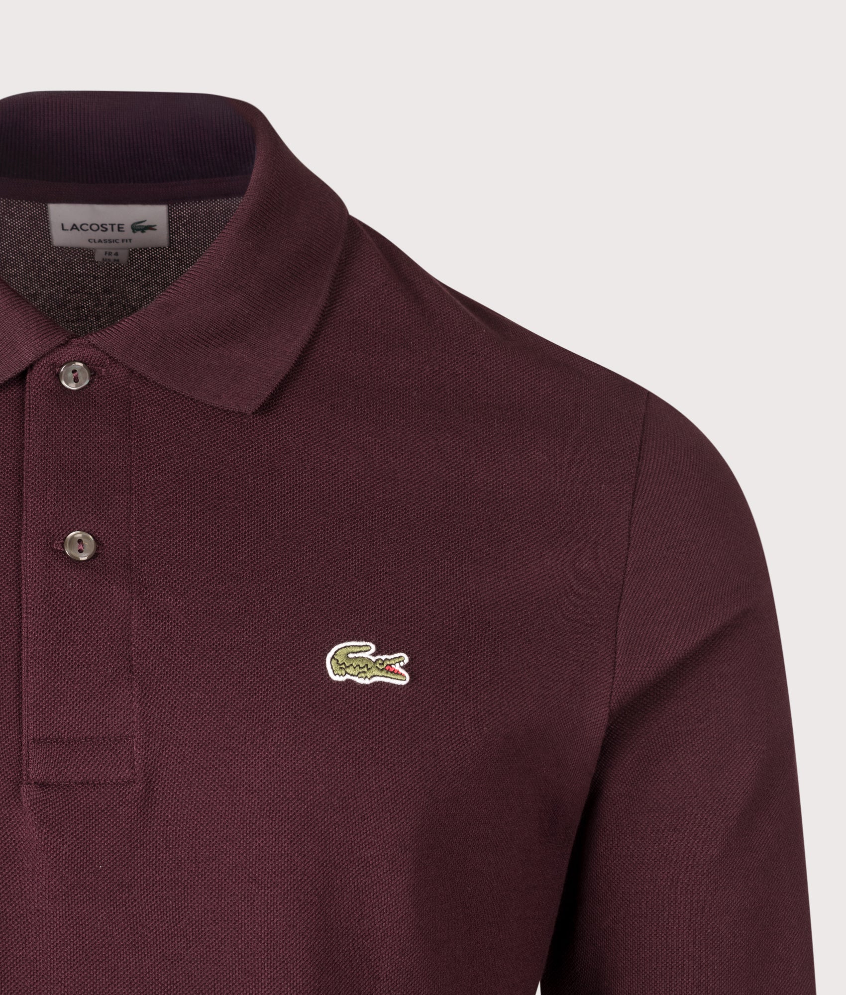 Lacoste Classic Fit Long Sleeve Croc Logo Polo Shirt in Chestnut Brown at EQVVS Menswear. Detail shot.