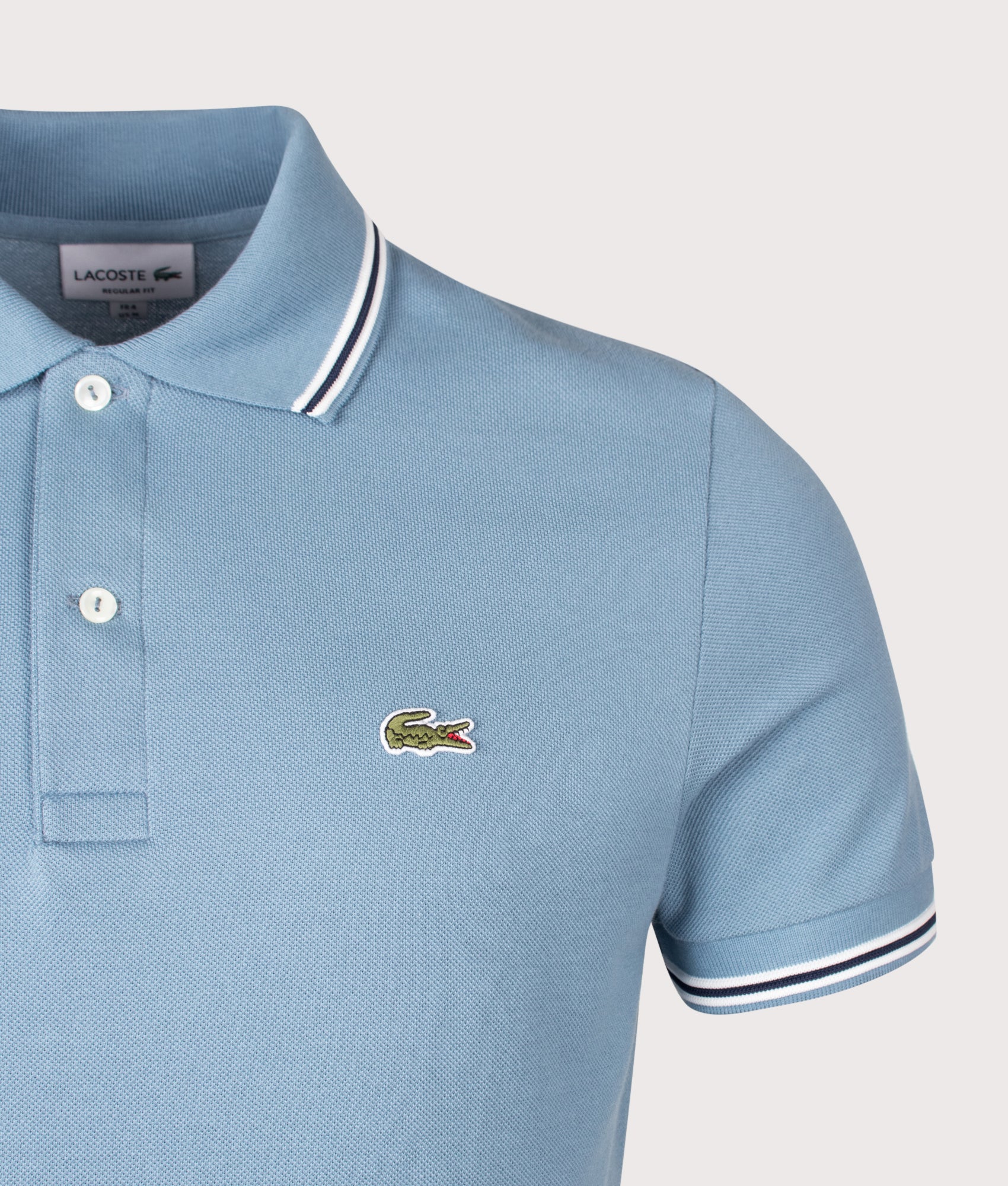 Lacoste Regular Fit Tipped Polo Shirt in Grayish Blue at EQVVS Menswear. Detail shot.