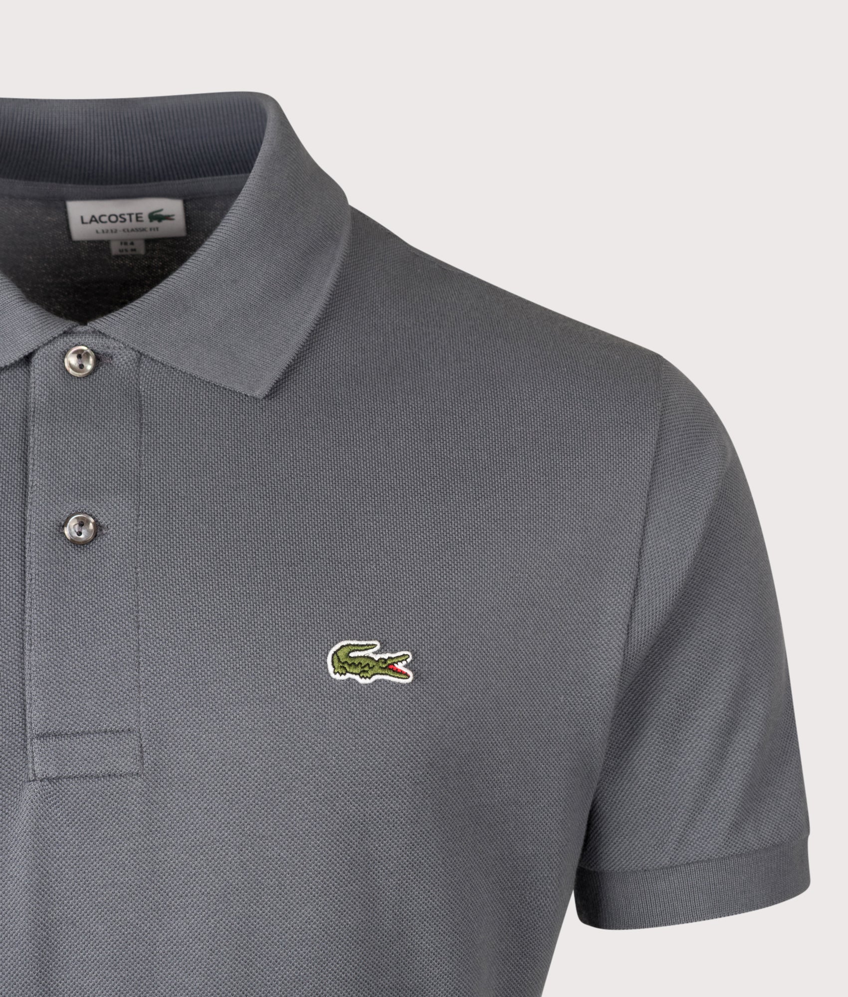 Lacoste Classic Fit L1212 Croc Logo Polo Shirt in Grey at EQVVS Menswear. Detail shot.