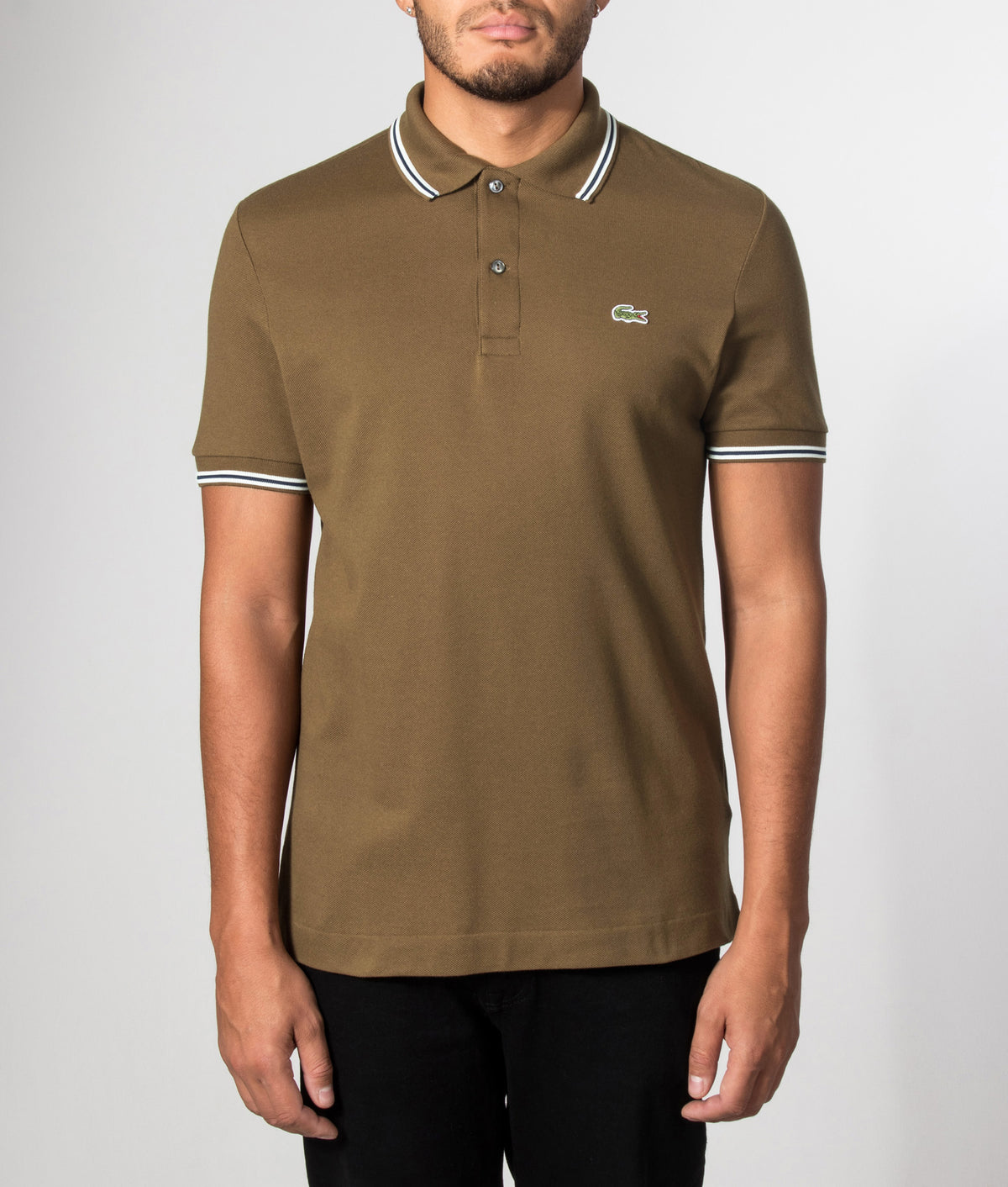 Lacoste Regular Fit Tipped Polo Shirt in Coffee Brown at EQVVS Menswear. Model front shot.