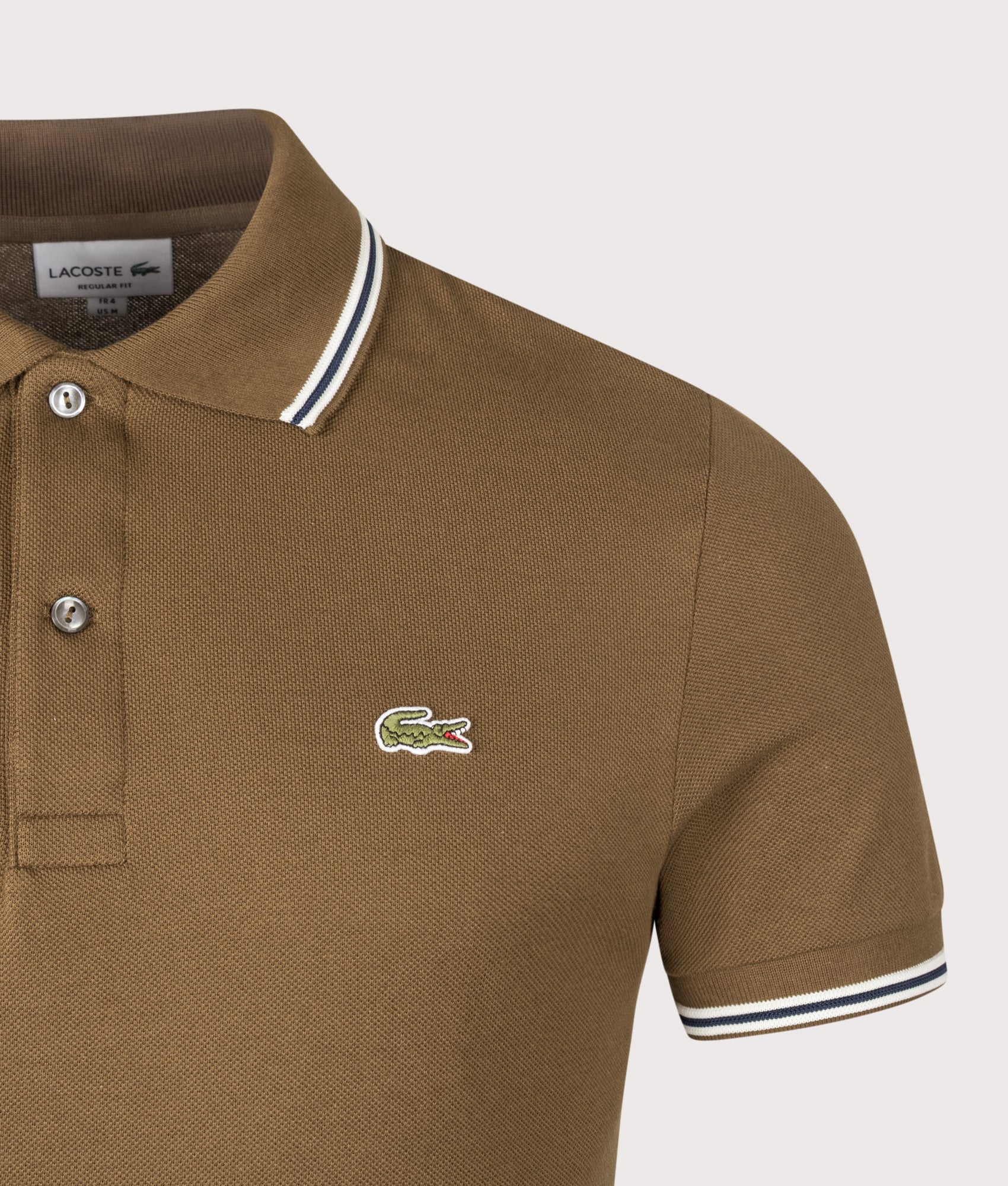 Lacoste Regular Fit Tipped Polo Shirt in Coffee Brown at EQVVS Menswear. Detail shot.