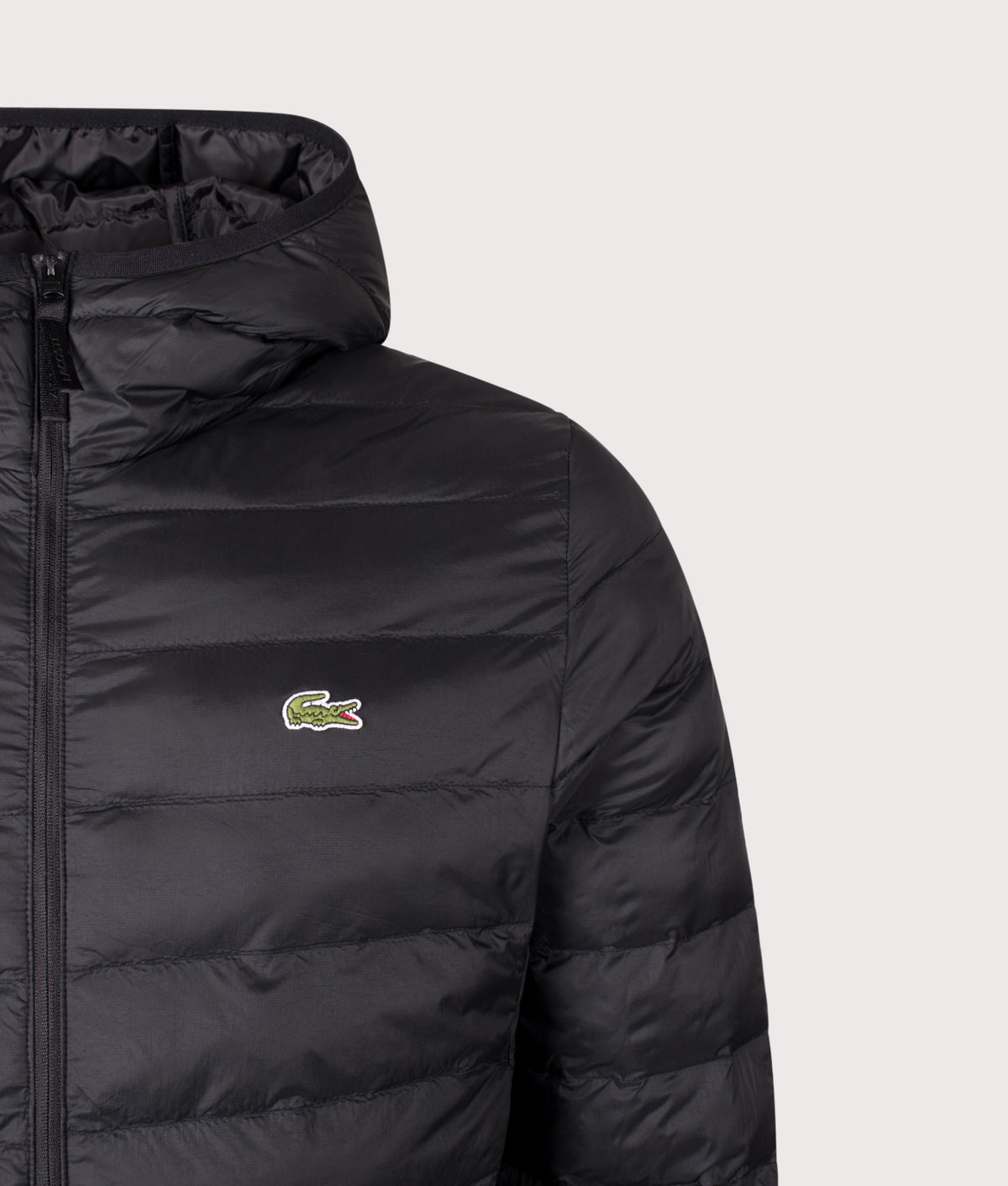Lacoste Regular Fit Down Puffer Jacket in Black at EQVVS Menswear. Detail shot.