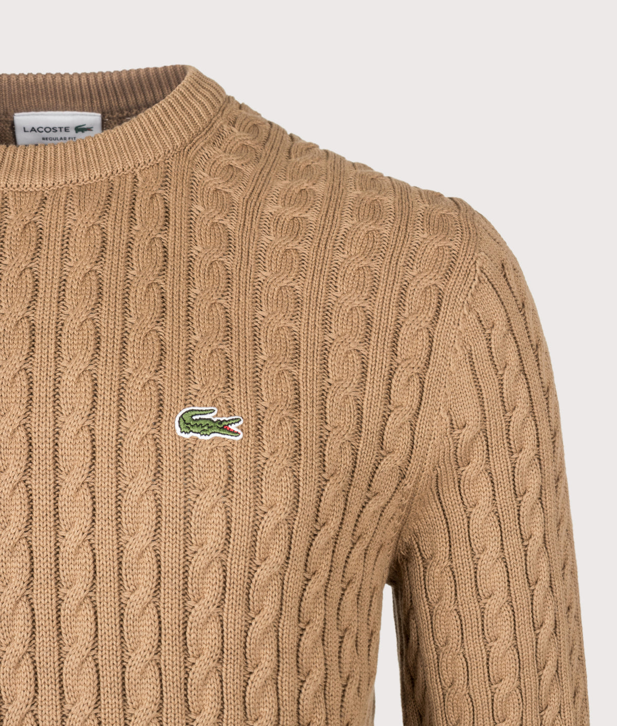 Lacoste Regular Fit Cable Knitted Jumper in Cookie and Green at EQVVS Menswear. Detail shot.