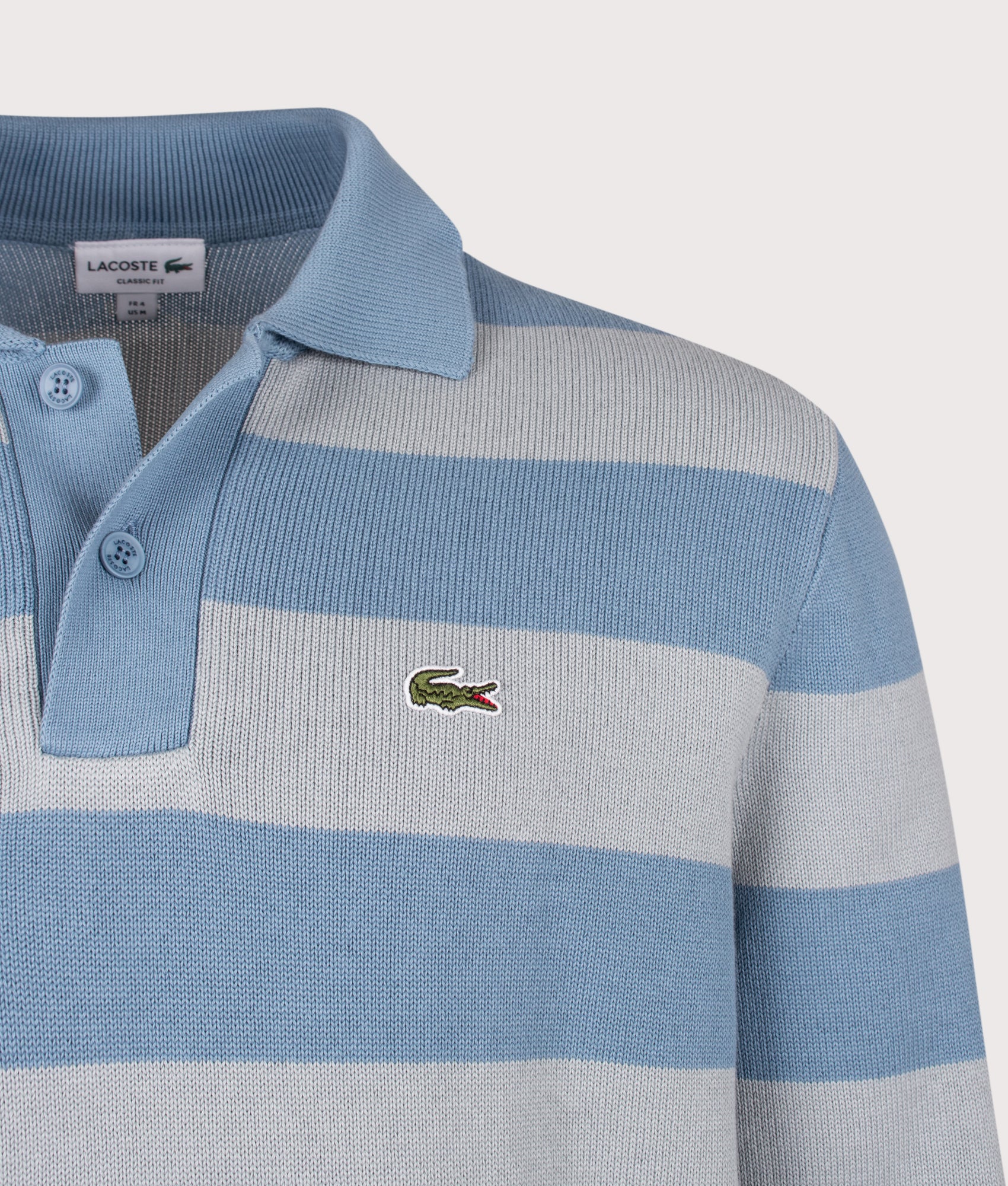 Lacoste Classic Fit Long Sleeve Knitted Polo Shirt in Aral and Shell Grey at EQVVS Menswear. Detail shot
