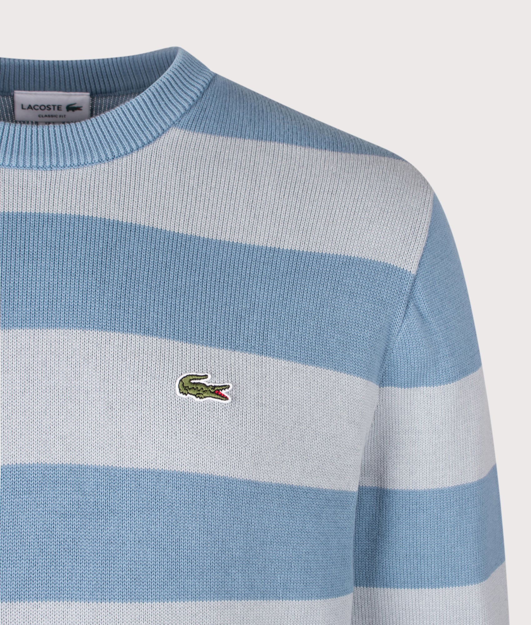 Lacoste Classic Fit Long Sleeve Knitted Jumper in Aral and Shell Grey at EQVVS Menswear. Detail shot.