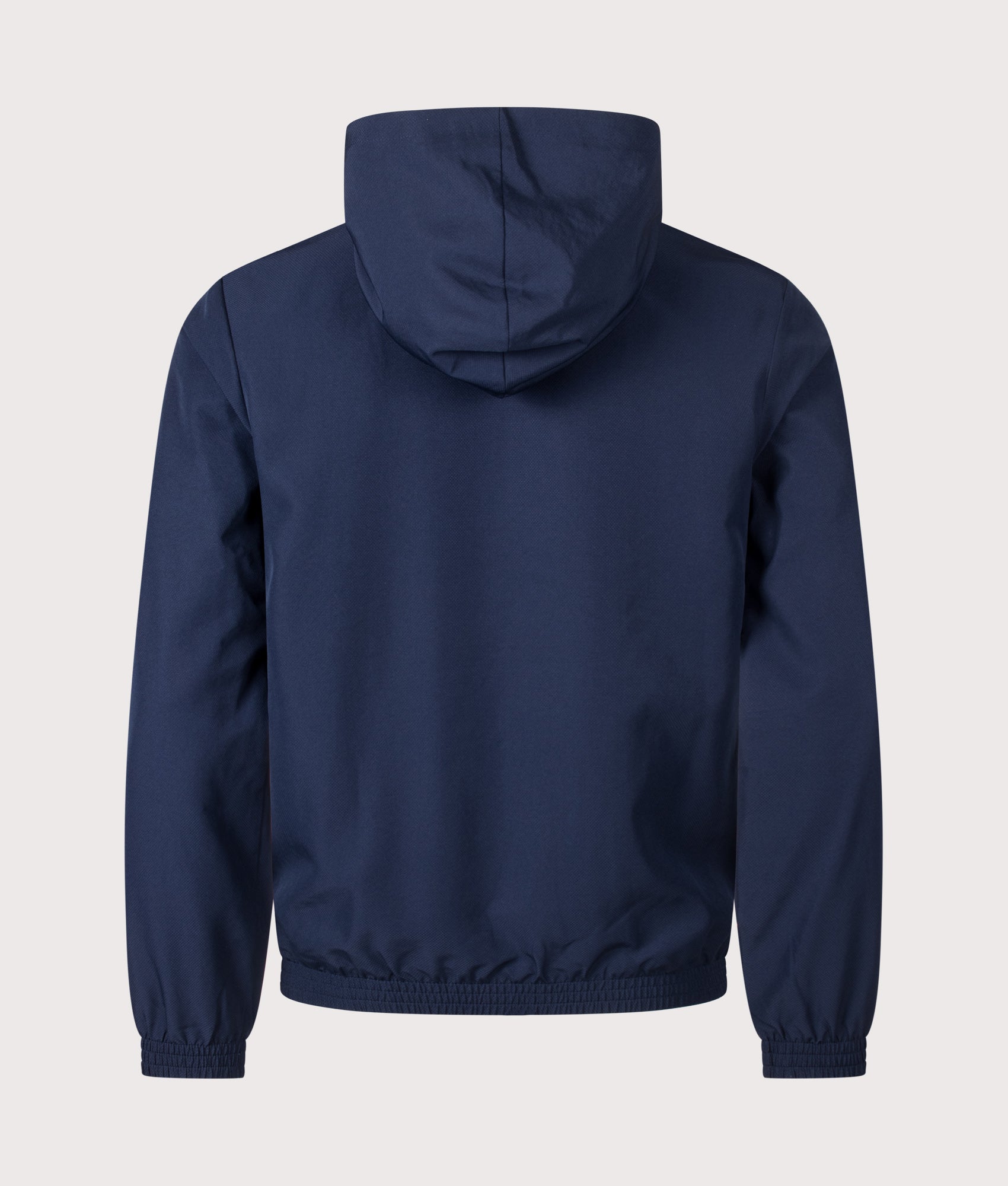 Lacoste Regular Fit Water-Repellent Sport Track Jacket in Navy Blue at EQVVS Menswear. Back shot.