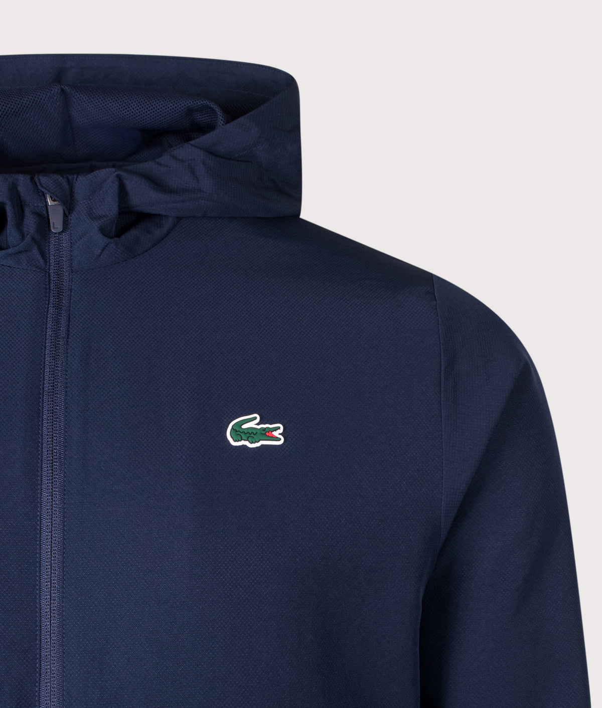 Lacoste Regular Fit Water-Repellent Sport Track Jacket in Navy Blue at EQVVS Menswear. Detail shot.